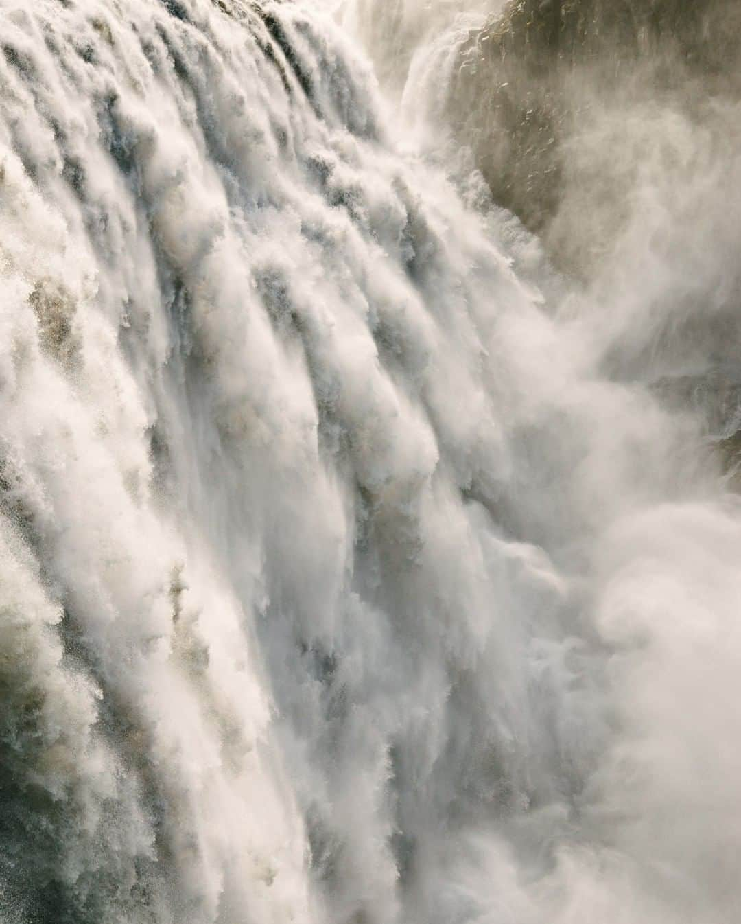 National Geographic Travelさんのインスタグラム写真 - (National Geographic TravelInstagram)「Photo by @kiliiiyuyan | The thundering Dettifoss falls in northeastern Iceland demands attention. Its many plumes constantly spray mist into the air, soaking the unwary tourist—a reminder that the scale of the natural world is beyond human. Follow me @kiliiiyuyan for more from the north and beyond. #iceland #waterfall #abstract」11月21日 14時09分 - natgeotravel