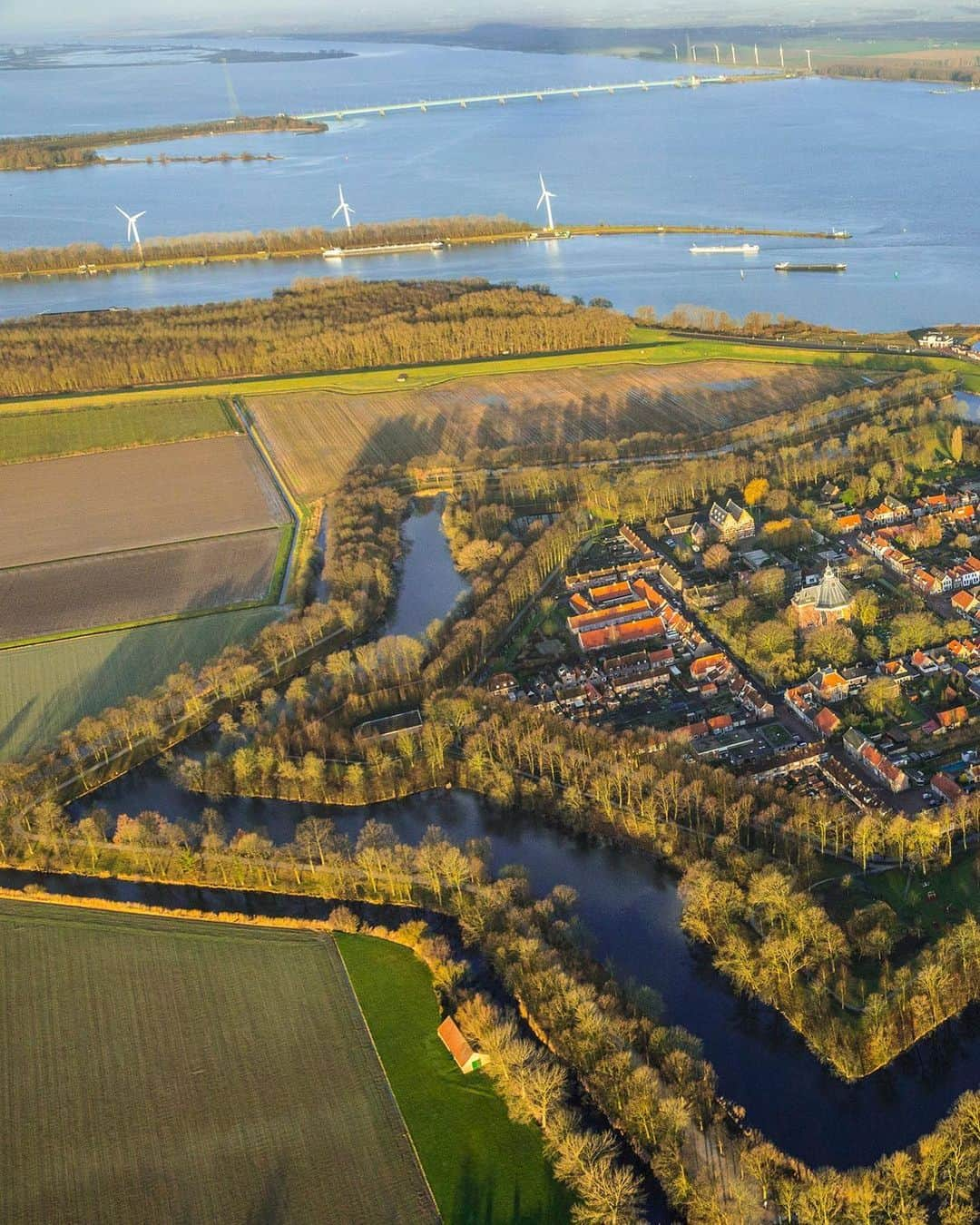 National Geographic Travelさんのインスタグラム写真 - (National Geographic TravelInstagram)「Photo by George Steinmetz @geosteinmetz | The Dutch city of Willemstad was fortified into a star shape in the 16th century during a conflict with Spain. The plan of the town fits so well with the fortifications that it is often thought that they were designed simultaneously. The idea for bastion forts was originated by Michelangelo during the age of cannon warfare and spread rapidly around the world. To view more of our world from above, follow @geosteinmetz.」11月22日 2時20分 - natgeotravel