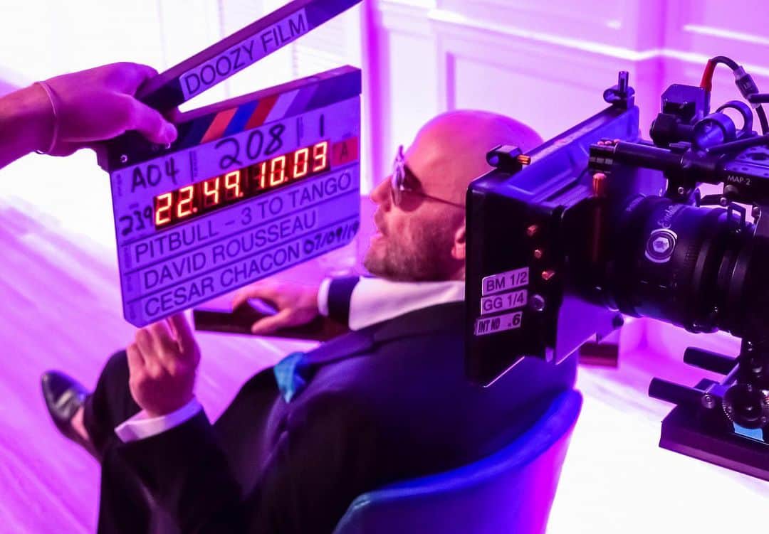 ピットブルのインスタグラム：「#TBT What an honor it was to have the great @johntravolta in the video for "3 To Tango!" Here's a behind the scenes shot from the shoot 🔥🔥」
