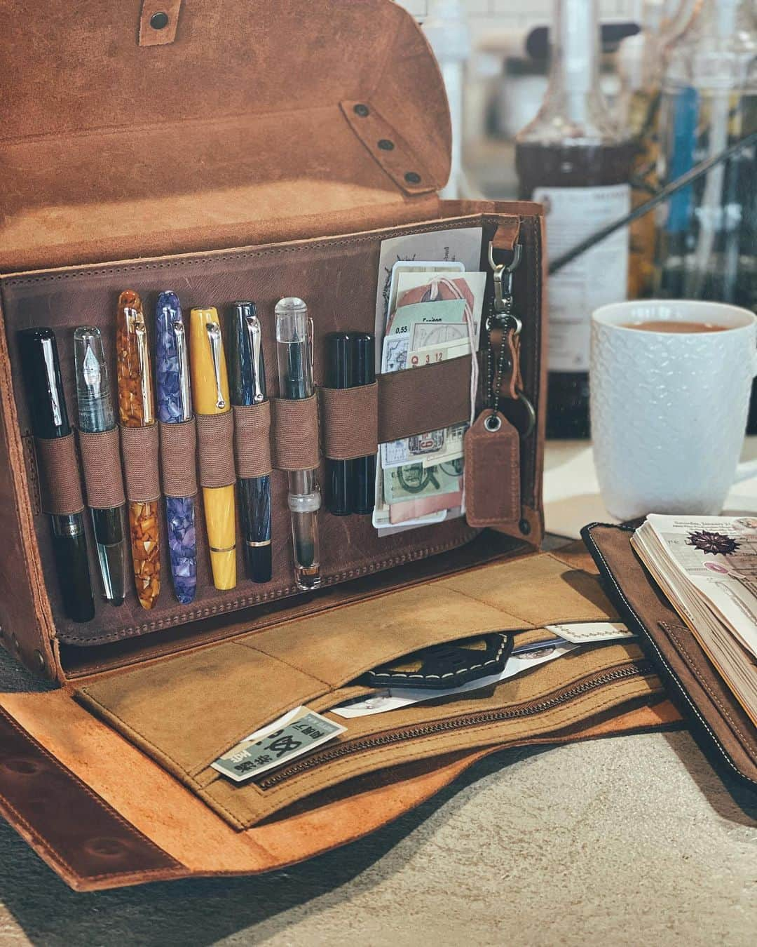 Catharine Mi-Sookさんのインスタグラム写真 - (Catharine Mi-SookInstagram)「Enjoying some quiet time at the local cafe with a hot mug of rooibos chai tea and a few of my favorite accoutrements. I started a weekly self-care #bulletjournal a few months ago and it’s such a wonderful resource to flip through especially during the holiday season, which is admittedly one of my favorite times of the year, as the kid in me still finds it so magical and wondrous, and yet it’s also the most hectic (aka I feel up to my eyeballs with work, projects and family schedules) and bittersweet (missing my dad) too. I’m being intentional this year with carving out more room for self-care, honoring my own boundaries and pausing in the midst. I want to savor the joyous moments and let them be the momentum that girds all else. I know the holidays can be a mixed bag for many, so my wish is that somehow that which brings you warmth and joy finds you extra this year. From my heart and mug to yours, cheers. ♥️☕️ . . . Featuring the @montegrappaitalia Miya 450, a very limited edition and celluloid beauty with sterling silver trim and a 14k gold nib offered at an introductory discount at @penchalet through the link in my bio or penchalet.com/cmisook. . Also featuring the Writer’s Medic Bag by @galen_leather and the last design of their founder (and beloved friend) Zeynep. It’s now available on their site with an introductory discount! The best time to snag one if you can! . TN Notebook @soumkine. Personalized Vagabond Notebook in Umber waxed canvas co-designed by @franklinchristoph & myself. . . . Pen & bag were gifted to me by the brands. . . . #journaling #selfcaredaily #selfcarematters #montegrappaitalia #montegrappapen #penchalet #fountainpens #penmanship #galenleather #writingbox #leatherhandbag #whatsinmybag #franklinchristoph #loveforanalogue #vagabondnotebook #soumkine #travelersnotebook #bujoideas #bujojunkies #bulletjournalideas #bulletjournaljunkies #planneraddict #bulletjournalweekly #stationerylover #stationeryaddict #thedailywriting #coffeeshopvibes #scrapbooking」11月28日 0時18分 - catharinemisook