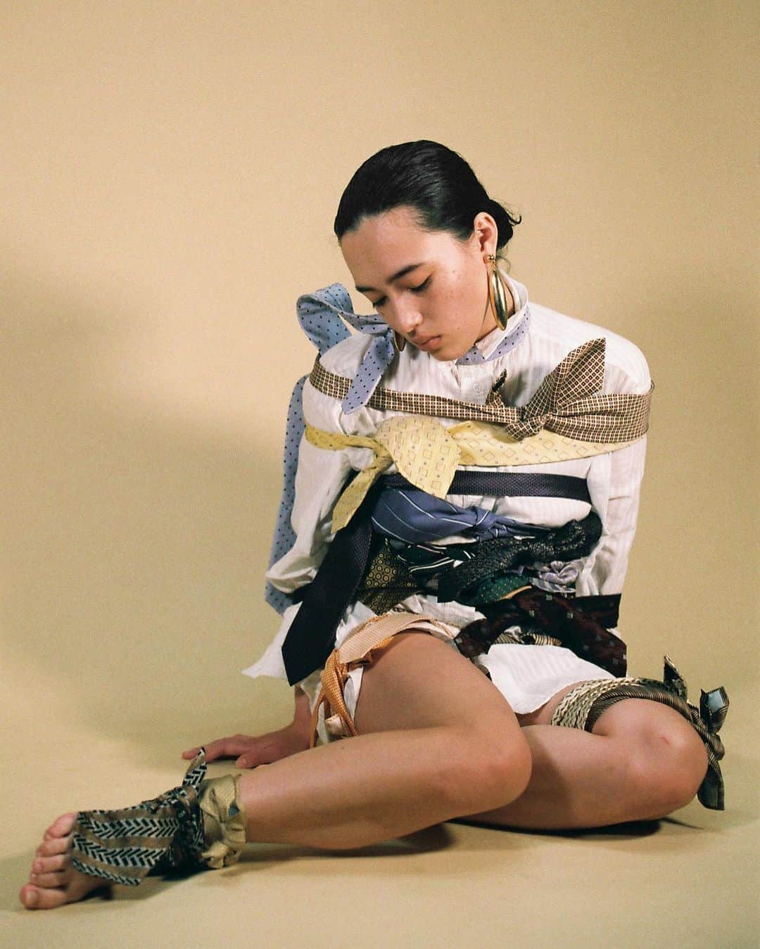 Megumuのインスタグラム：「ー昭和94年ー　@dewmagazine We exist in a continuing past. The change of eras is used to mark progress in time and society, with the end of Heisei (90s, 00s, 10s) and the start of Reiwa (20’s-forward) signaling a breaking point from the past. However, these closings and openings of old and new eras provide little more than the illusion of linear progress towards a future. Truthfully we exist in the modern past, where technology and infrastructure advanced but social experiences remain eternally on loop, stuck. Progress is rarely linear, and in Japan’s case it may be stagnant; Japan was named 76th out of 77 countries in gender equality by a recent study. The workspace is a particular point of contention, with issues such as maternal leave, marriage, career progression and pay equality in male-dominated companies at the forefront. Given the current situation in Japan, the female is very much still the male’s to define, limit, use and most of all sexualize. This is still, Showa year 94. 昭和94年。 CREDITS Photography and Styling @yumeboi Hair and Make-up @chifumi325 Model Megumu」