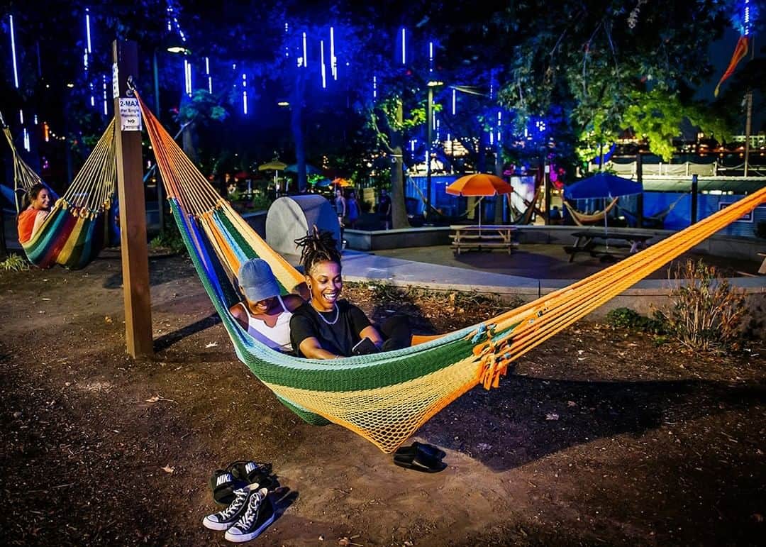 National Geographic Travelさんのインスタグラム写真 - (National Geographic TravelInstagram)「Photo by @dina_litovsky | People relax in one of the 50 hammocks strung throughout Spruce Street Harbor Park, a seasonal network of landscaped barges, floating gardens, and outdoor games bordering Philadelphia's Delaware River waterfront. The colorful city is featured in National Geographic Traveler’s December/January issue. For more images, follow me @dina_litovsky.」11月29日 22時07分 - natgeotravel