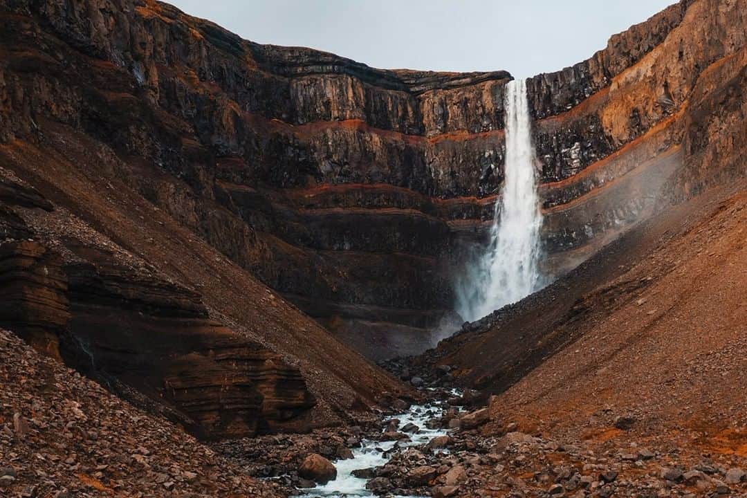National Geographic Travelさんのインスタグラム写真 - (National Geographic TravelInstagram)「Photo by Matt Borowick @mborowick | Hengifoss is a beautiful waterfall in the Fljótsdalur valley not far away from Egilsstaðir. At 420 feet, it is one of the highest waterfalls in Iceland. What makes Hengifoss different than most of the other waterfalls in the country is the visible red layers behind the falls. Each and every layer represents a different period of climate in Iceland. It’s often referred to as fossil soil. For more pictures from Iceland, follow @mborowick. #iceland #nordic #waterfall #nature #adventure」11月30日 18時08分 - natgeotravel
