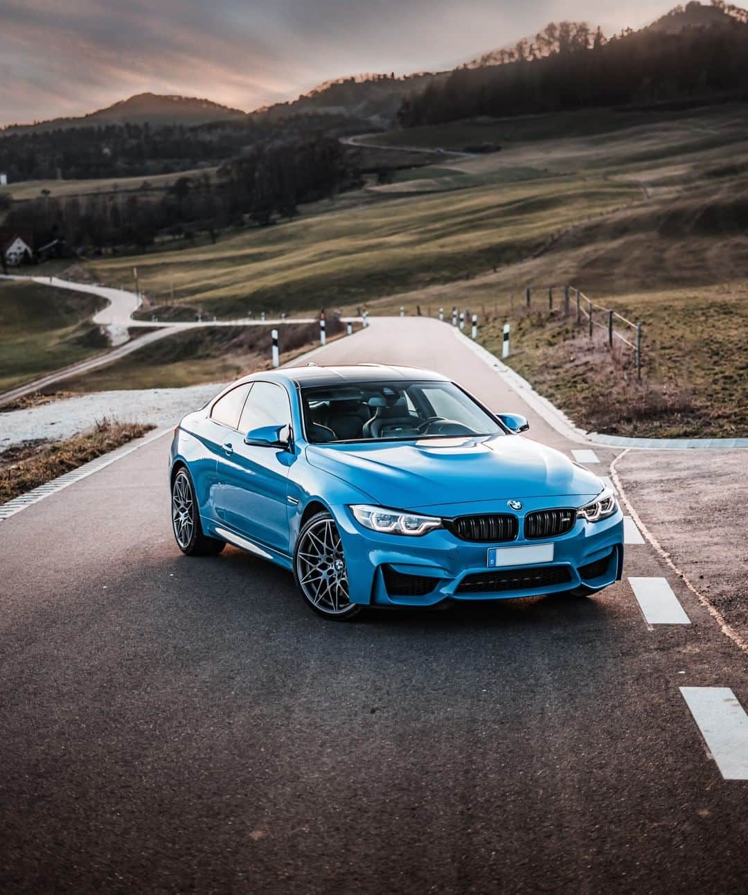 BMWのインスタグラム：「Used to others' endless admiration. The BMW M4 Coupé. #TheM4 #BMW #M4 #BMWM #BMWrepost @m4_bluebeast @max.carphotography __ BMW M4 Coupé with Competition Package: Fuel consumption in l/100 km (combined): 10.0 [9.3]. CO2 emissions in g/km (combined): 227 [213]. Acceleration (0-100 km/h): 4.2 s [4.0 s]. Power: 331 kW, 450 hp, 550 Nm. Top speed (limited): 250 km/h (with optional M Drivers Package: 280 km/h). Paint finish shown: Yas Marina Blue.  The figures in brackets refer to the vehicle with seven-speed M double-clutch transmission with Drivelogic. The values of fuel consumptions, CO2 emissions and energy consumptions shown were determined according to the European Regulation (EC) 715/2007 in the version applicable at the time of type approval. The figures refer to a vehicle with basic configuration in Germany and the range shown considers optional equipment and the different size of wheels and tires available on the selected model. The values of the vehicles are already based on the new WLTP regulation and are translated back into NEDC-equivalent values in order to ensure the comparison between the vehicles. [With respect to these vehicles, for vehicle related taxes or other duties based (at least inter alia) on CO2-emissions the CO2 values may differ to the values stated here.] The CO2 efficiency specifications are determined according to Directive 1999/94/EC and the European Regulation in its current version applicable. The values shown are based on the fuel consumption, CO2 values and energy consumptions according to the NEDC cycle for the classification. Further information on official fuel consumption figures and specific CO2 emission values of new passenger cars is included in the following guideline: 'Leitfaden über den Kraftstoffverbrauch, die CO2-Emissionen und den Stromverbrauch neuer Personenkraftwagen' (Guide to the fuel economy, CO2 emissions and electric power consumption of new passenger cars), which can be obtained free of charge from all dealerships, from Deutsche Automobil Treuhand GmbH (DAT), Hellmuth-Hirth-Str. 1, 73760 Ostfildern-Scharnhausen and at https://www.dat.de/co2/.」