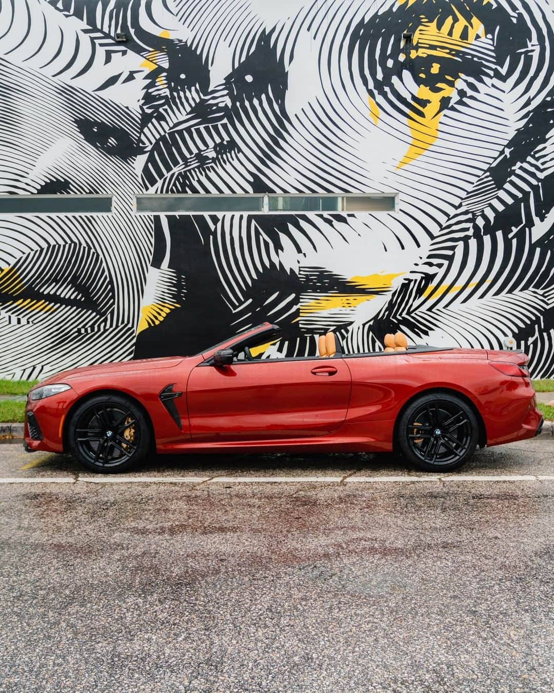 BMWのインスタグラム：「A picture is worth a thousand words.  @artbasel Miami. The first-ever BMW M8 Competition Convertible. #TheM8 #BMW #M8 #BMWM @bmwgroupculture @2alasofficial  __ BMW M8 Competition Convertible: Fuel consumption in l/100 km (combined): 10.8. CO2 emissions in g/km (combined): 246.  Acceleration (0-100 km/h): 3.3 s. Power: 460 kW, 625 hp, 750 Nm. Top speed (limited): 250 km/h (with optional M Drivers Package: 305 km/h). Paint finish shown: Motegi Red metallic.  The values of fuel consumptions, CO2 emissions and energy consumptions shown were determined according to the European Regulation (EC) 715/2007 in the version applicable at the time of type approval. The figures refer to a vehicle with basic configuration in Germany and the range shown considers optional equipment and the different size of wheels and tires available on the selected model. The values of the vehicles are already based on the new WLTP regulation and are translated back into NEDC-equivalent values in order to ensure the comparison between the vehicles. [With respect to these vehicles, for vehicle related taxes or other duties based (at least inter alia) on CO2-emissions the CO2 values may differ to the values stated here.] The CO2 efficiency specifications are determined according to Directive 1999/94/EC and the European Regulation in its current version applicable. The values shown are based on the fuel consumption, CO2 values and energy consumptions according to the NEDC cycle for the classification. Further information on official fuel consumption figures and specific CO2 emission values of new passenger cars is included in the following guideline: 'Leitfaden über den Kraftstoffverbrauch, die CO2-Emissionen und den Stromverbrauch neuer Personenkraftwagen' (Guide to the fuel economy, CO2 emissions and electric power consumption of new passenger cars), which can be obtained free of charge from all dealerships, from Deutsche Automobil Treuhand GmbH (DAT), Hellmuth-Hirth-Str. 1, 73760 Ostfildern-Scharnhausen and at https://www.dat.de/co2/.」