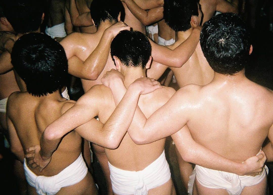 東京DANDYのインスタグラム：「For over 500 years, on one of the coldest nights of the year, over nine thousand men in loin clothes descend on Saidaiji Temple in Okayama Prefecture. After running through freezing cold water in a purification ritual, they amass within the temple. Priests toss a lucky talisman from a balcony, and the men wrestle to grab it, the victor blessed with a year of good luck. People have died at this festival - it's hardcore. Even in the wait before the scramble begins, the jostling for space sends bodies tumbling down the steep stone steps. How unique rites-of-passage establish a local sense of identity is a key theme of these kinds of images in my book DISPSOABLES. . #DisposablesBook #Disposables #Festival #Matsuri #35mm #Tradition #Japan #Okayama #西大寺 #使い捨てカメラ #はだか祭り #祭り #DisposableCamera #日本 #Photobook #analogphotography」