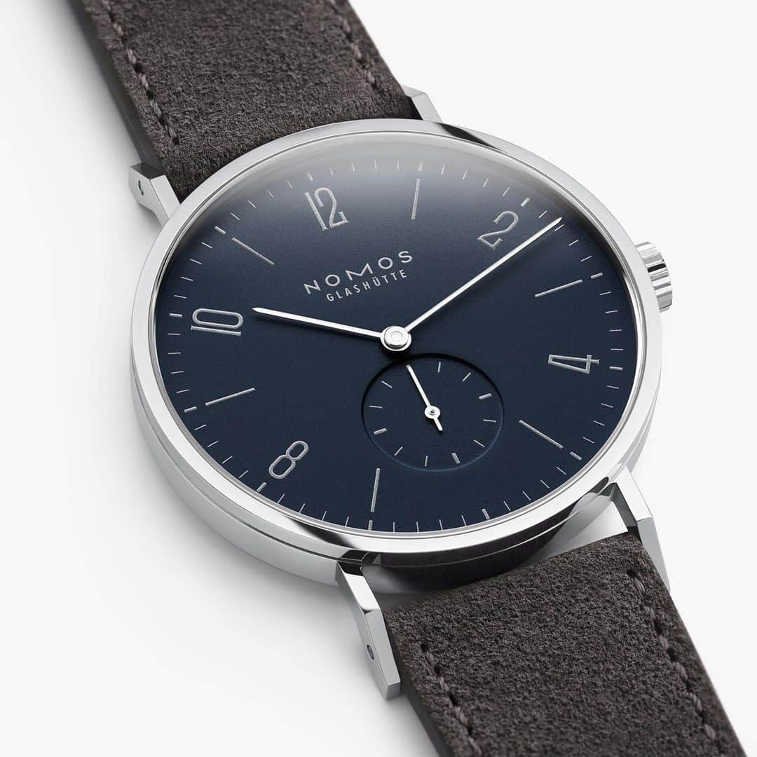 のインスタグラム：「Dress code: elegant. The classic NOMOS model Tangente is now available in two hand-wound versions with dials in a festive hue. Silver accents add seasonal sparkle to Tangente 38 midnight blue. An elegant contrast: the dark velour leather strap.  #nomos #nomosglashuette #nomostangente #christmasgift #jewellery #christmasiscoming #watchesforchristmas #watch #wristwatch #watchlover #watchesofinstagram」