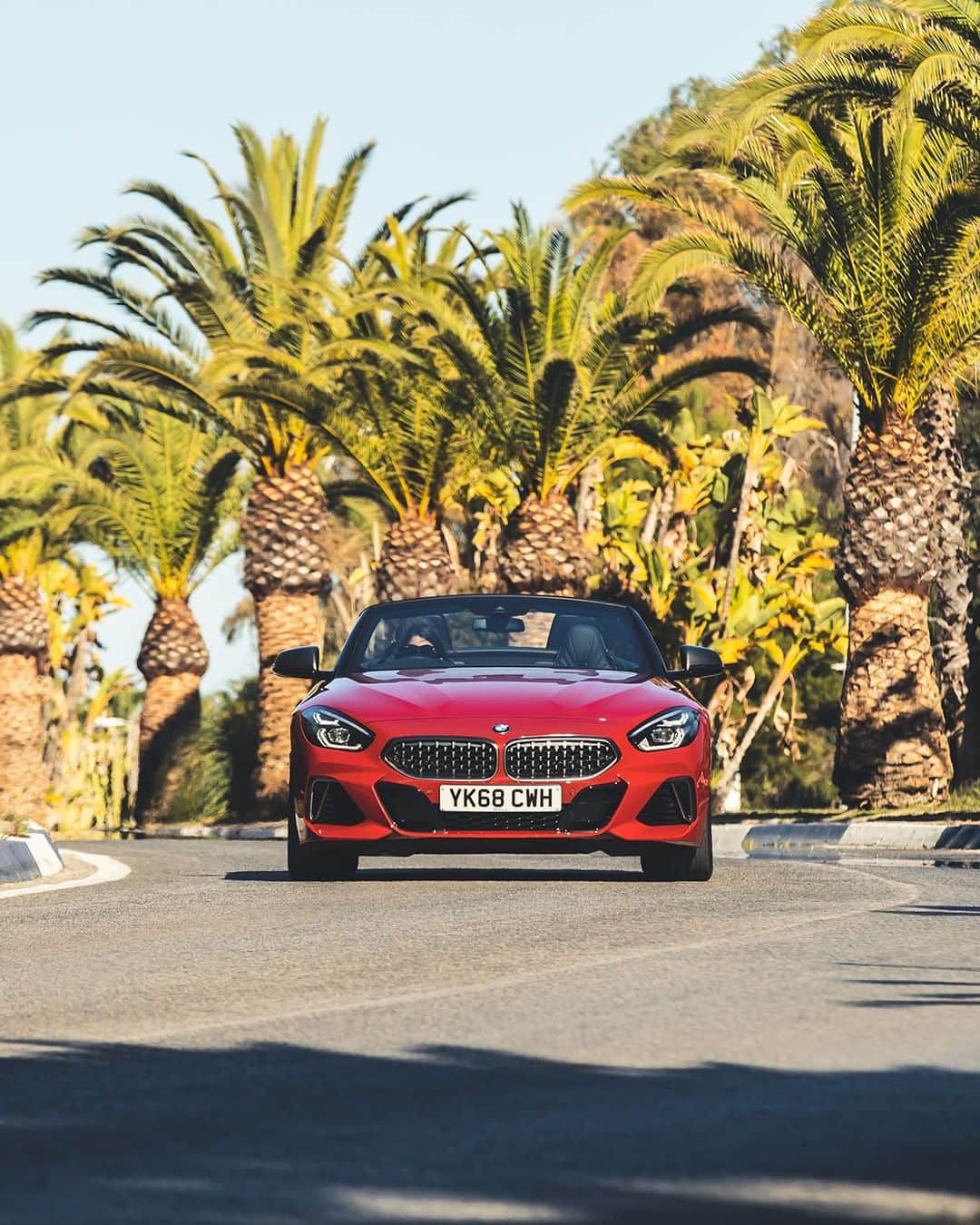 BMWのインスタグラム：「This is how everyone imagines a scenic ride. The BMW Z4. #TheZ4 #BMW #Z4 __ BMW Z4 M40i: Fuel consumption in l/100 km (combined): 7.4. CO2 emissions in g/km (combined): 168.  Acceleration (0-100 km/h): 4.5 s. Power: 250 kW, 340 hp, 500 Nm. Top speed (limited): 250 km/h. Paint finish shown: San Francisco Red metallic.  The values of fuel consumptions, CO2 emissions and energy consumptions shown were determined according to the European Regulation (EC) 715/2007 in the version applicable at the time of type approval. The figures refer to a vehicle with basic configuration in Germany and the range shown considers optional equipment and the different size of wheels and tires available on the selected model. The values of the vehicles are already based on the new WLTP regulation and are translated back into NEDC-equivalent values in order to ensure the comparison between the vehicles. [With respect to these vehicles, for vehicle related taxes or other duties based (at least inter alia) on CO2-emissions the CO2 values may differ to the values stated here.] The CO2 efficiency specifications are determined according to Directive 1999/94/EC and the European Regulation in its current version applicable. The values shown are based on the fuel consumption, CO2 values and energy consumptions according to the NEDC cycle for the classification. Further information on official fuel consumption figures and specific CO2 emission values of new passenger cars is included in the following guideline: 'Leitfaden über den Kraftstoffverbrauch, die CO2-Emissionen und den Stromverbrauch neuer Personenkraftwagen' (Guide to the fuel economy, CO2 emissions and electric power consumption of new passenger cars), which can be obtained free of charge from all dealerships, from Deutsche Automobil Treuhand GmbH (DAT), Hellmuth-Hirth-Str. 1, 73760 Ostfildern-Scharnhausen and at https://www.dat.de/co2/.」