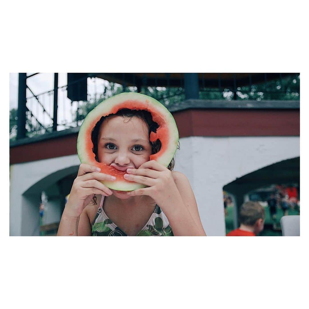 Robert Bingamanのインスタグラム：「A frame from a project I continue to work on about Humboldt, Kansas. This young lady beat out several very hungry looking boys to win the watermelon eating competition.」