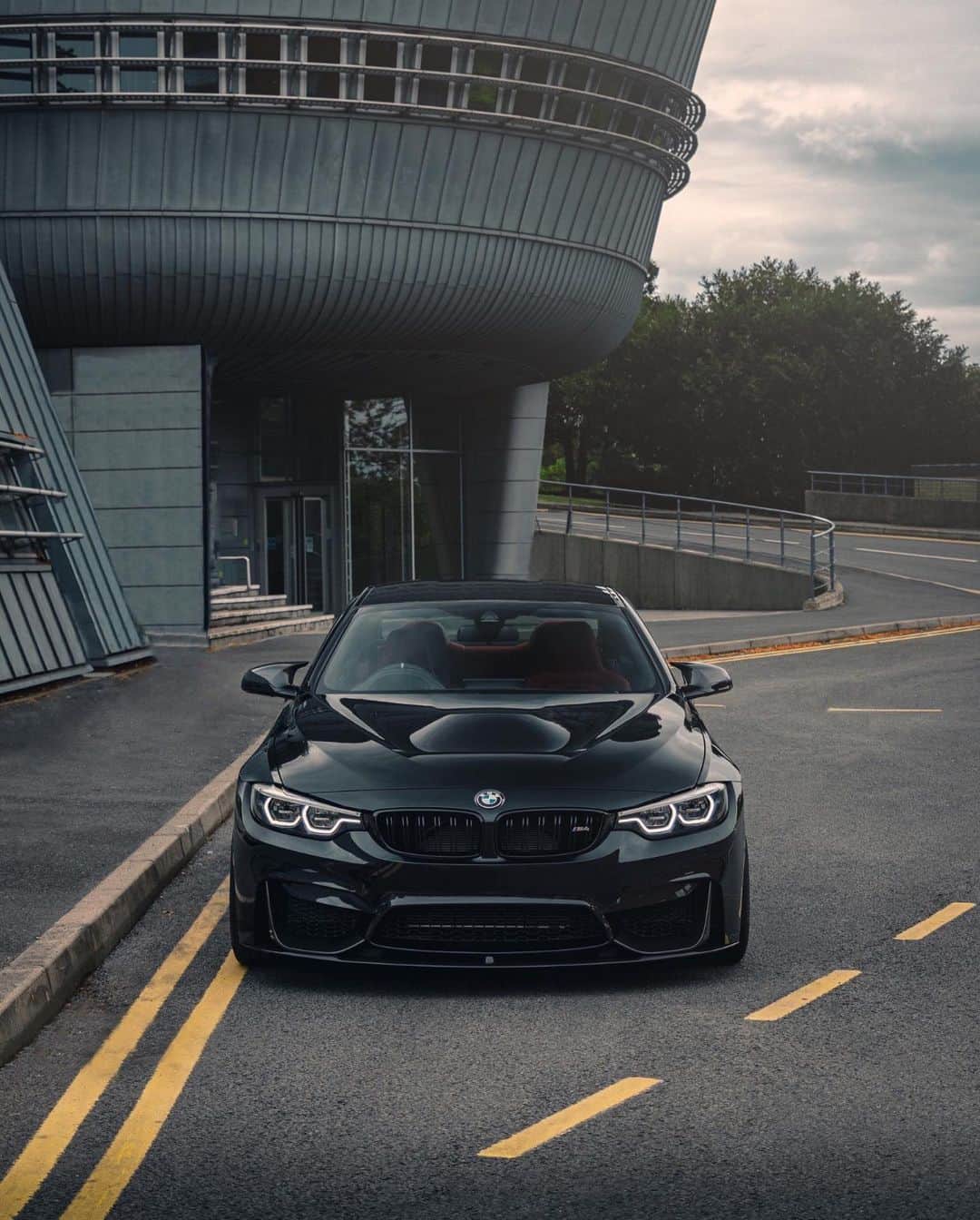 BMWのインスタグラム：「A black outfit with plenty of features. The BMW M4 Coupé with Competition Package. #TheM4 #BMW #M4 #BMWM #BMWrepost @deathlyhallow_m4 @arm4g3don __ BMW M4 Coupé with Competition Package: Fuel consumption in l/100 km (combined): 10.0 [9.3]. CO2 emissions in g/km (combined): 227 [213]. Acceleration (0-100 km/h): 4.2 s [4.0 s]. Power: 331 kW, 450 hp, 550 Nm. Top speed (limited): 250 km/h (with optional M Drivers Package: 280 km/h). Paint finish shown: Black Sapphire metallic.  The figures in brackets refer to the vehicle with seven-speed M double-clutch transmission with Drivelogic. The values of fuel consumptions, CO2 emissions and energy consumptions shown were determined according to the European Regulation (EC) 715/2007 in the version applicable at the time of type approval. The figures refer to a vehicle with basic configuration in Germany and the range shown considers optional equipment and the different size of wheels and tires available on the selected model. The values of the vehicles are already based on the new WLTP regulation and are translated back into NEDC-equivalent values in order to ensure the comparison between the vehicles. [With respect to these vehicles, for vehicle related taxes or other duties based (at least inter alia) on CO2-emissions the CO2 values may differ to the values stated here.] The CO2 efficiency specifications are determined according to Directive 1999/94/EC and the European Regulation in its current version applicable. The values shown are based on the fuel consumption, CO2 values and energy consumptions according to the NEDC cycle for the classification. Further information on official fuel consumption figures and specific CO2 emission values of new passenger cars is included in the following guideline: 'Leitfaden über den Kraftstoffverbrauch, die CO2-Emissionen und den Stromverbrauch neuer Personenkraftwagen' (Guide to the fuel economy, CO2 emissions and electric power consumption of new passenger cars), which can be obtained free of charge from all dealerships, from Deutsche Automobil Treuhand GmbH (DAT), Hellmuth-Hirth-Str. 1, 73760 Ostfildern-Scharnhausen and at https://www.dat.de/co2/.」