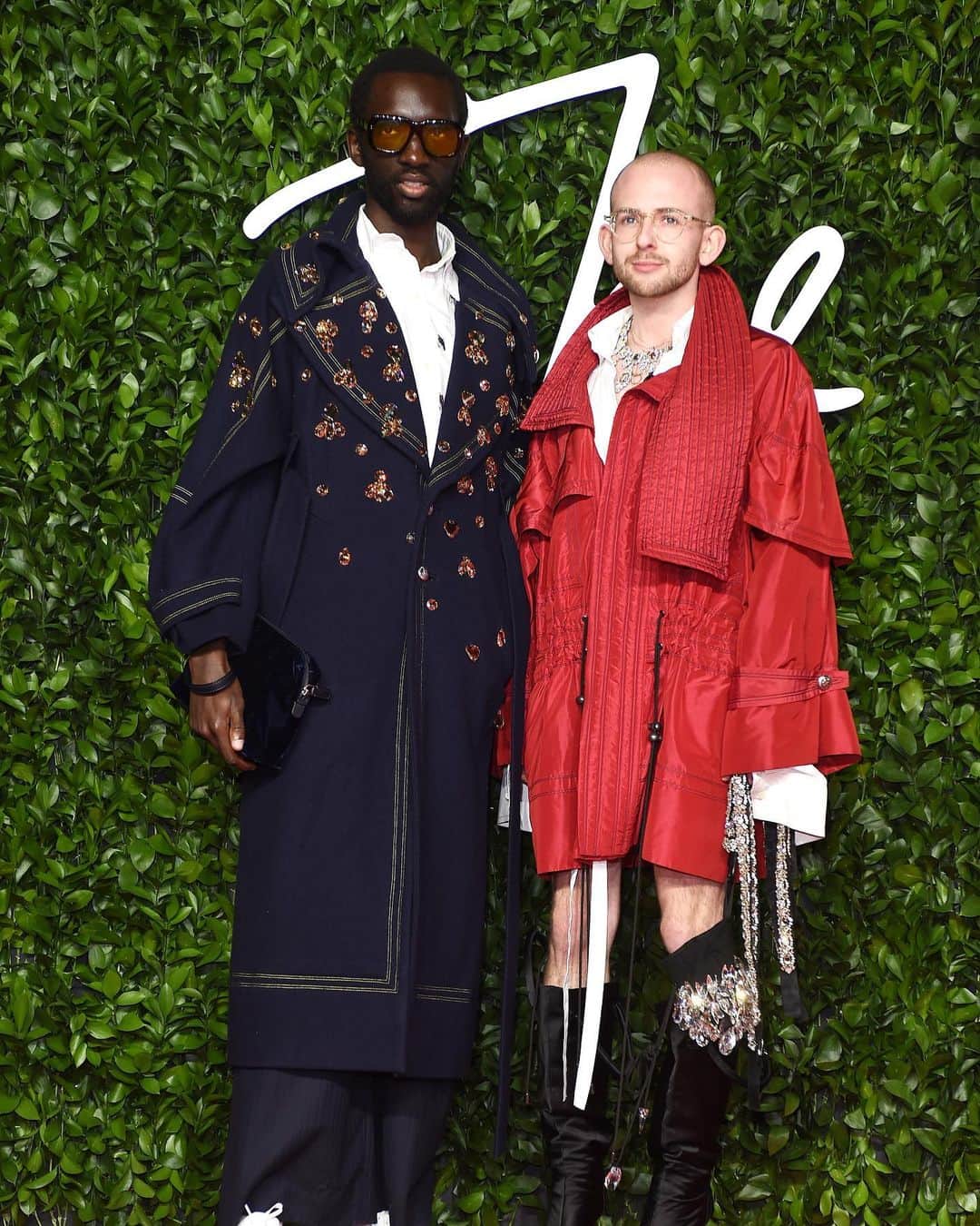 SWAROVSKIさんのインスタグラム写真 - (SWAROVSKIInstagram)「Swarovki continues to support emerging brands and we strive to work with conscious designers who mirror our commitment to sustainability. Here patrick__mcdowell strikes a pose with model and performer @wilson_oryema in a crystal-embellished overcoat at the #Fashion Awards 2019 red carpet. . . . #ConsciousDesign #SwarovskiCreativeCollaborations」12月7日 1時55分 - swarovski
