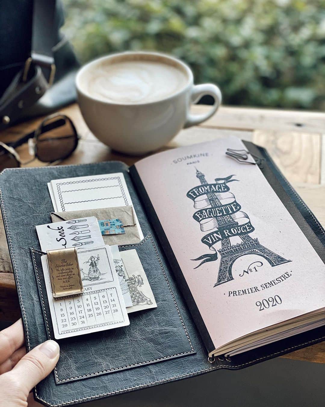 Catharine Mi-Sookさんのインスタグラム写真 - (Catharine Mi-SookInstagram)「First day in a new planner. Setting my intentions and goals, but first clearing the palette for dreams, big unabashed ones. Happy new cadence and new now. From my mug to yours, a hearty cheers! ☕️ . . . . Fromage Baguette Vin Rouge Planner @soumkine. Model 46 Fountain Pen in Winter Pine with the steel extra fine flex nib @franklinchristoph. Stickers @kiroku.de. Vagabond Notebook in NWF Dark Brown & Fortis Slingbag co-designed with @franklinchristoph - link in bio for both. Fusion Aviators @randolphusa. . . . . #planner2020 #journaling #soumkine #vagabondnotebook #fortisslingbag #franklinchristoph #fountainpens #teamkiroku #stationeryshop #bulletjournallove #bujo2020 #bujoinspo #bujoinspiration #stationeryaddict #stationerylove #loveforanalogue #travelersnotebook #scrapbooking #scrapbooklayout #coffeeshopcorners #coffeenclothes #coffeeshopsoftheworld #slowlived #thedailywriting #slowlivingforlife #creativejournal #creativejournaling #myrandolphs #aviatorsunglasses」1月3日 3時01分 - catharinemisook