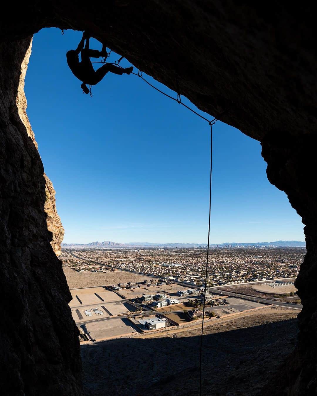 アレックス・オノルドのインスタグラム：「@samuelcrossley took this photo of me trying a route at the Suburban crag the other day, right in the middle of Vegas (you can see the Strip in the background!). Few things: does anyone know anything about this route? It’s the direct start into “Steep”, the juggy 13a that’s included in Islands in the Sky. Maybe bolted by Leo Henson? Or maybe an old Brian McCray project?! It felt like maybe 13d to me? Curious if anyone’s done it before.  Also, there’s a @southernnevadaclimbers clean up at the crag tomorrow, which is awesome. It can definitely use some love.  Lastly, I really appreciate these limestone crags in town - it’s great to have climbing available for cold or wet days. And it’s a nice way to spread out the crowds...」