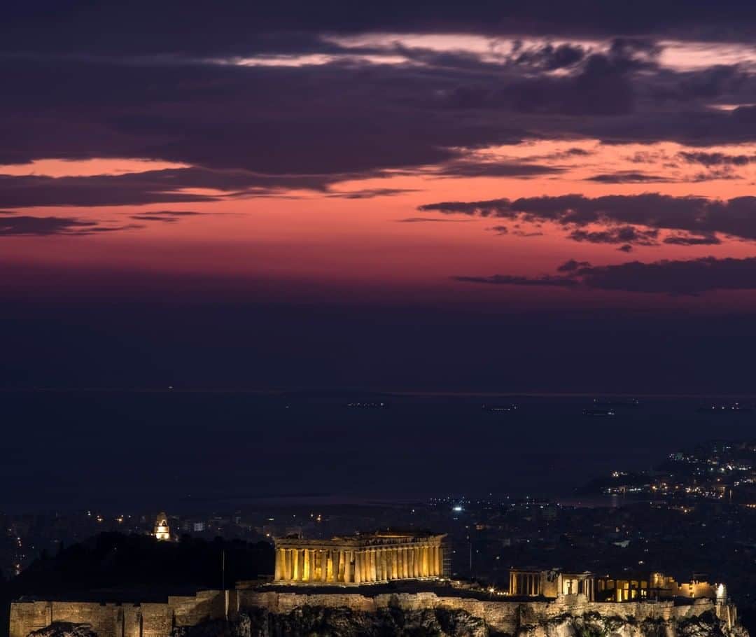 National Geographic Travelさんのインスタグラム写真 - (National Geographic TravelInstagram)「Photo by Muhammed Muheisen @mmuheisen | The Parthenon glows atop the ancient Acropolis hill in Athens, Greece, with the Saronic Gulf seen in the background. For more photos and videos from different parts of the world, follow me @mmuheisen and @mmuheisenpublic. #muhammedmuheisen #Greece #Athens #Acropolis #Parthenon」12月14日 6時05分 - natgeotravel