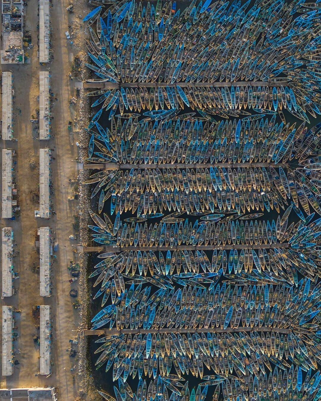 ナショナルジオグラフィックさんのインスタグラム写真 - (ナショナルジオグラフィックInstagram)「Photo by George Steinmetz @geosteinmetz | Octopus boats clog Nouadhibou Harbor, in Mauritania, at the end of the fishing season. In Mauritania, some 70% of the local boats are used to catch octopus for the Japanese market. #onassignment for an upcoming story in @natgeo. To view more of our world from above, follow me, @geosteinmetz.」12月19日 0時38分 - natgeo