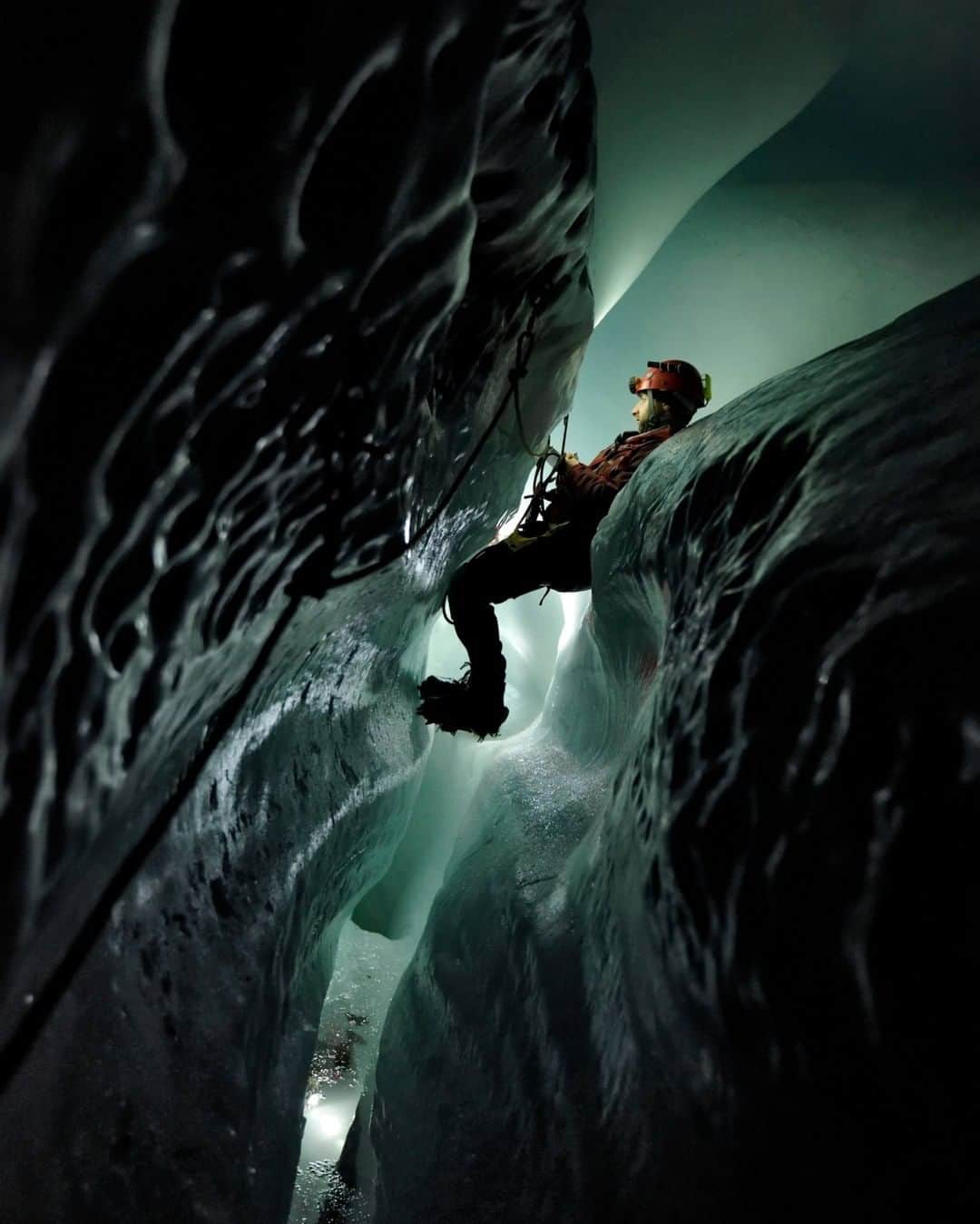 National Geographic Travelさんのインスタグラム写真 - (National Geographic TravelInstagram)「Photo by Robbie Shone @shonephoto | Below the surface of the Gorner Glacier in the Swiss Alps, a glaciologist from Aberystwyth University traverses along a tunnel of ice. Carved out by water, this crack in the glacier has been enlarged over time by erosion and melting.」12月19日 22時07分 - natgeotravel