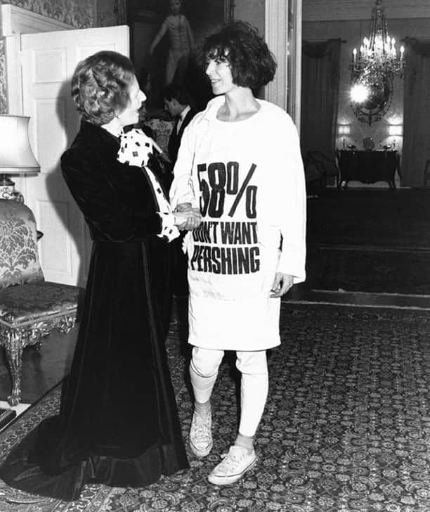 のインスタグラム：「The “58% Don’t Want Pershing” came from a European opinion poll about the proliferation of American cruise and Pershing nuclear missiles across Europe without consulting the electorate, which was totally undemocratic.⠀ I hid it under my jacket. We all lined up and the moment I shook Thatcher’s hand, I opened my jacket so the writing would be completely legible to the photographers in the room, who went crazy with their flashbulbs. She looked down and said, “You seem to be wearing a rather strong message on your T-shirt”, then she bent down to read it and let out a squawk, like a chicken.⠀ #margaretthatcher #katharinehamnett #1984 @10downingstreet」