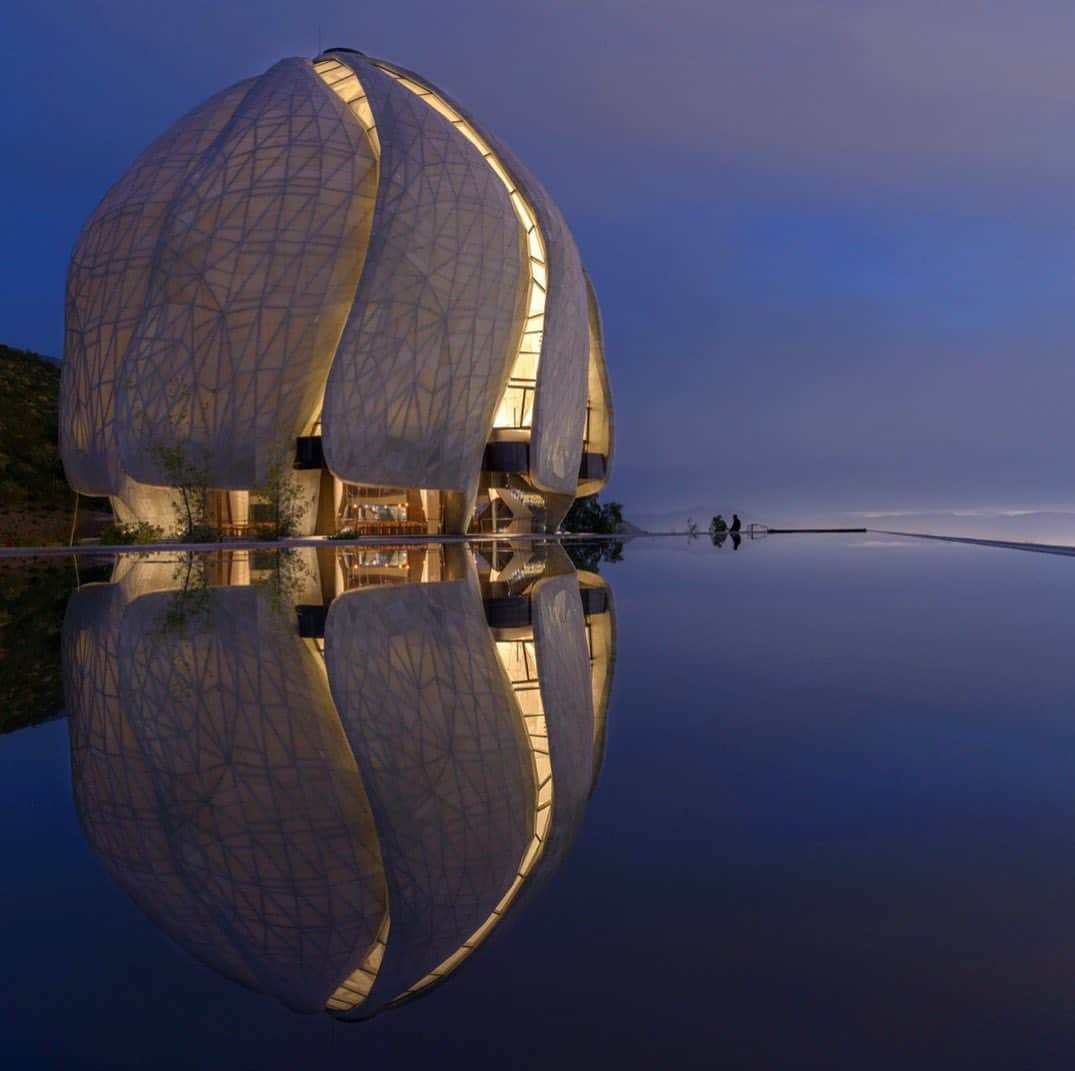 TED Talksのインスタグラム：「What does it take to create a sacred experience in a secular world? That was the question architect Siamak Hariri explored while designing the Bahá'í Temple of South America. The end result is iridescent: made with stone and glass, it appears translucent and lights up, and the shape captures the movement of the sun throughout the day. “In a world which is putting up walls, the design needed to express in form the very opposite,” he says. “It had to be open, welcoming to people of all faiths, walks of life, backgrounds, or no faith at all; a new form of sacred space with no pattern or models to draw from.” Learn more about his creative process at the link in our bio.  Photo courtesy of Siamak Hariri」