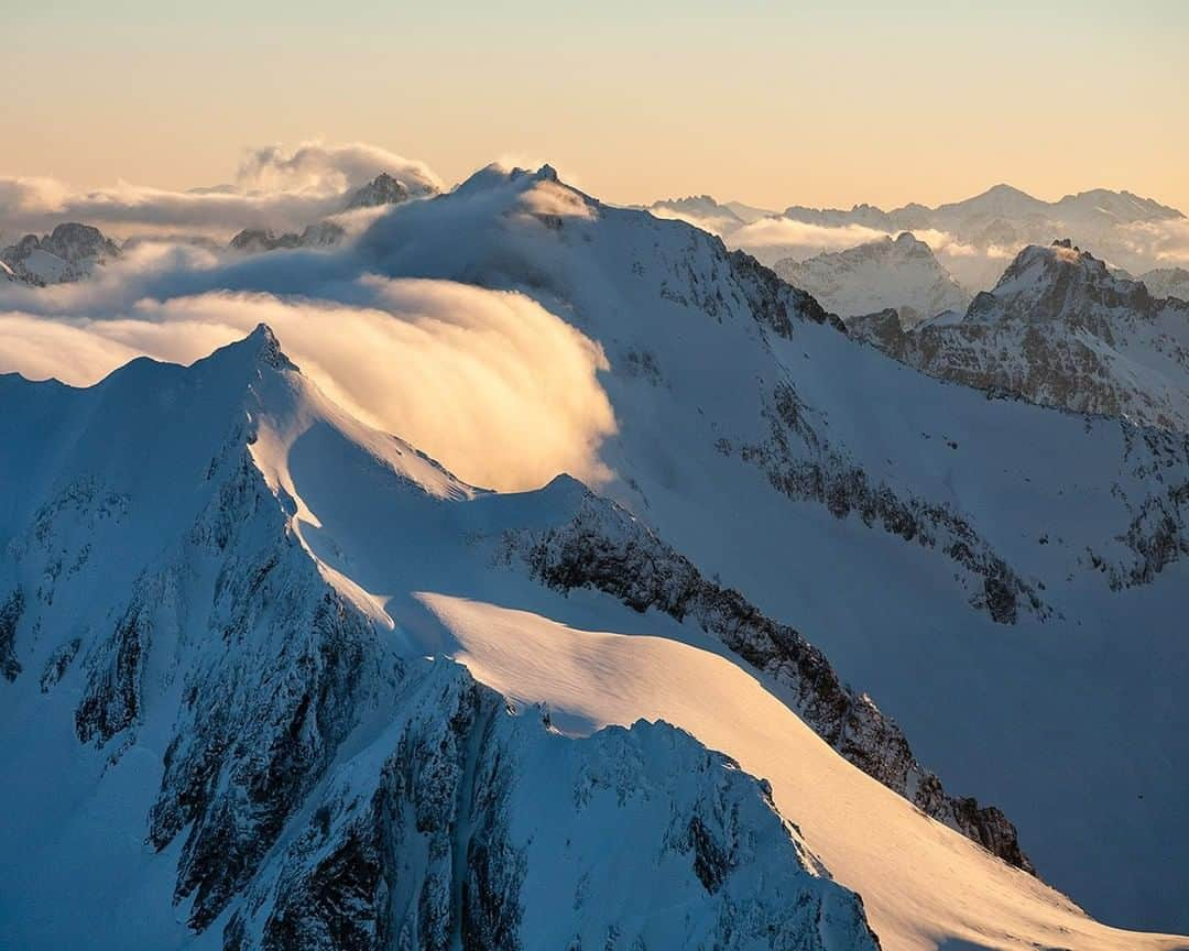 National Geographic Travelさんのインスタグラム写真 - (National Geographic TravelInstagram)「Photo by @stephen_matera | Low clouds flow over the ridge between the Sahale and Buckner Mountains in North Cascades National Park, Washington. The North Cascades are a rugged wilderness of old-growth forests, rock, and ice. Follow me @stephen_matera for more images like this from Washington and around the world. #northcascades #wilderness #aerialphotography」12月29日 0時06分 - natgeotravel