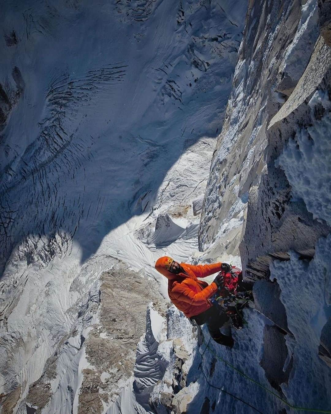 National Geographic Travelさんのインスタグラム写真 - (National Geographic TravelInstagram)「Photo by @jimmychin | There is a feeling of absurdity in climbing big mountains, when the ground feels far below and you’re still fighting your way upward. Alpine climbing is an exercise in risk assessment and motivation, and it often conjures up the existential questions of life. The edge between success and failure is thin. There is not much room for miscalculation. It is living in that tension that brings clarity. This was taken in the Garhwal Himalaya in India. For more images of mountain climbs follow @jimmychin.⁠」12月29日 5時05分 - natgeotravel