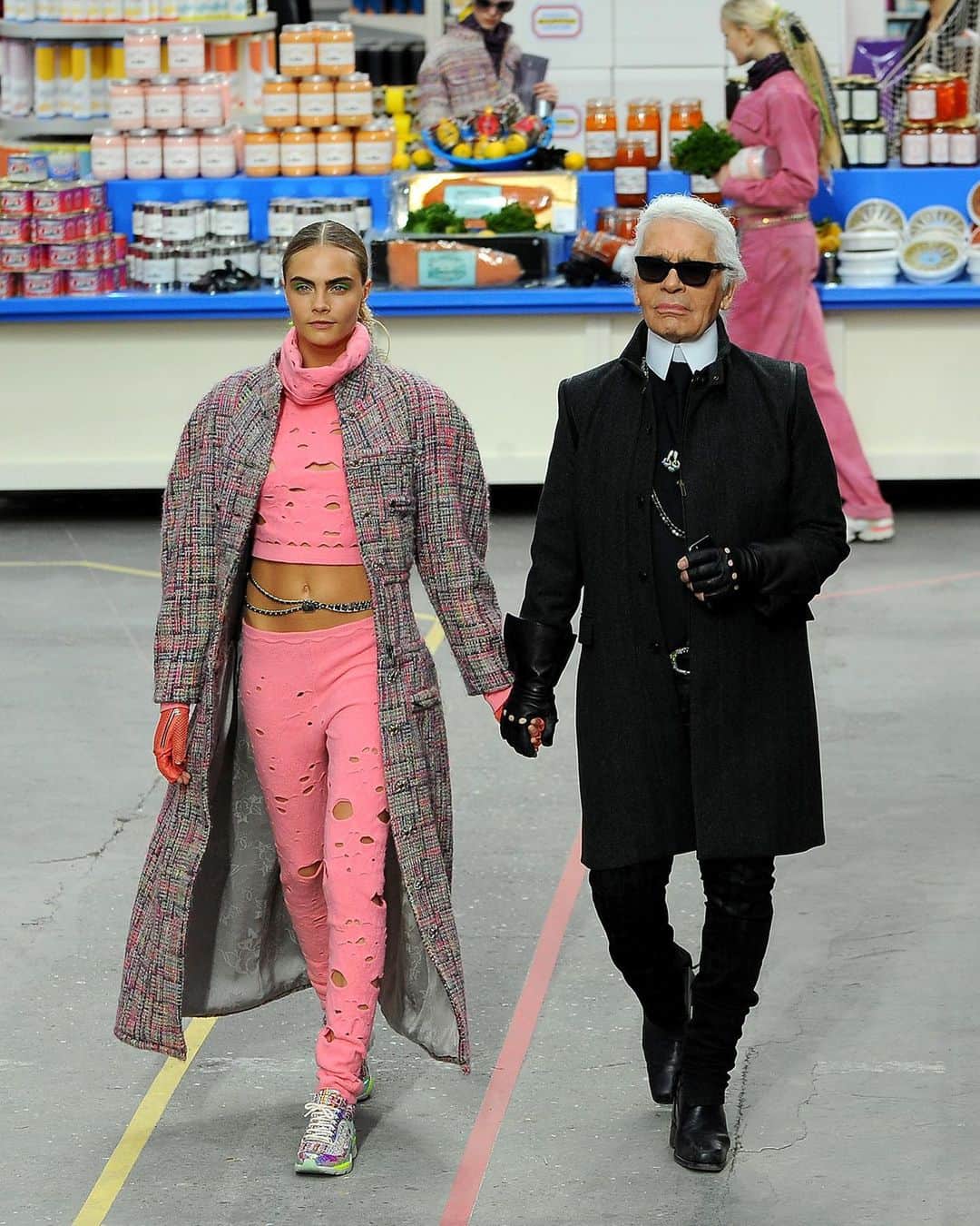 Fashion Weekのインスタグラム：「Looking back, @chanelofficial's supermarche remains one of the most memorable shows of the decade. 🍎 See more from Chanel's extraordinary show in March 2014. @caradelevingne and the late creative director Karl Lagerfeld on the runway by @gettyimages.」