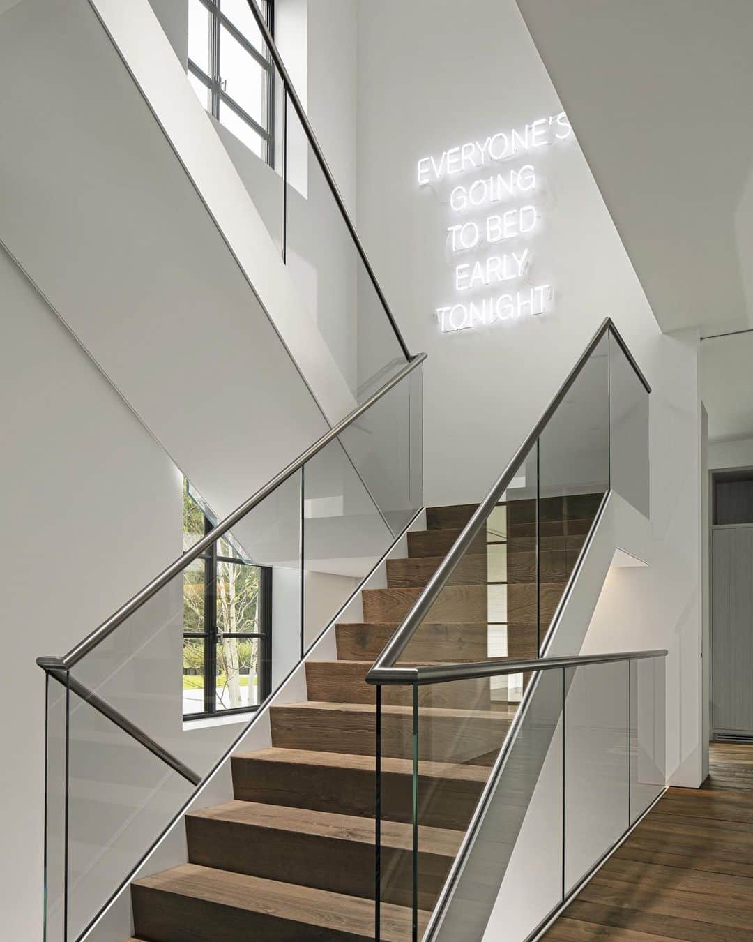 ELLE DECORさんのインスタグラム写真 - (ELLE DECORInstagram)「A custom neon sign by @nameglo in this entry stair hall displays a quote supplied by the homeowners for a @jennyfischbachdesign and @rogerferrispartners-designed  farmhouse located in Westport, Connecticut on the Long Island Sound. For a family of four—including two teenagers and a large dog—the weekend home’s casual-yet-elevated interiors offer a calming respite, with sensible that can handle a mess here and there—and look good doing it. Click the link in bio for the full tour, as seen in our January/February 2020 issue. Photography: @durstonsaylor」12月30日 8時11分 - elledecor