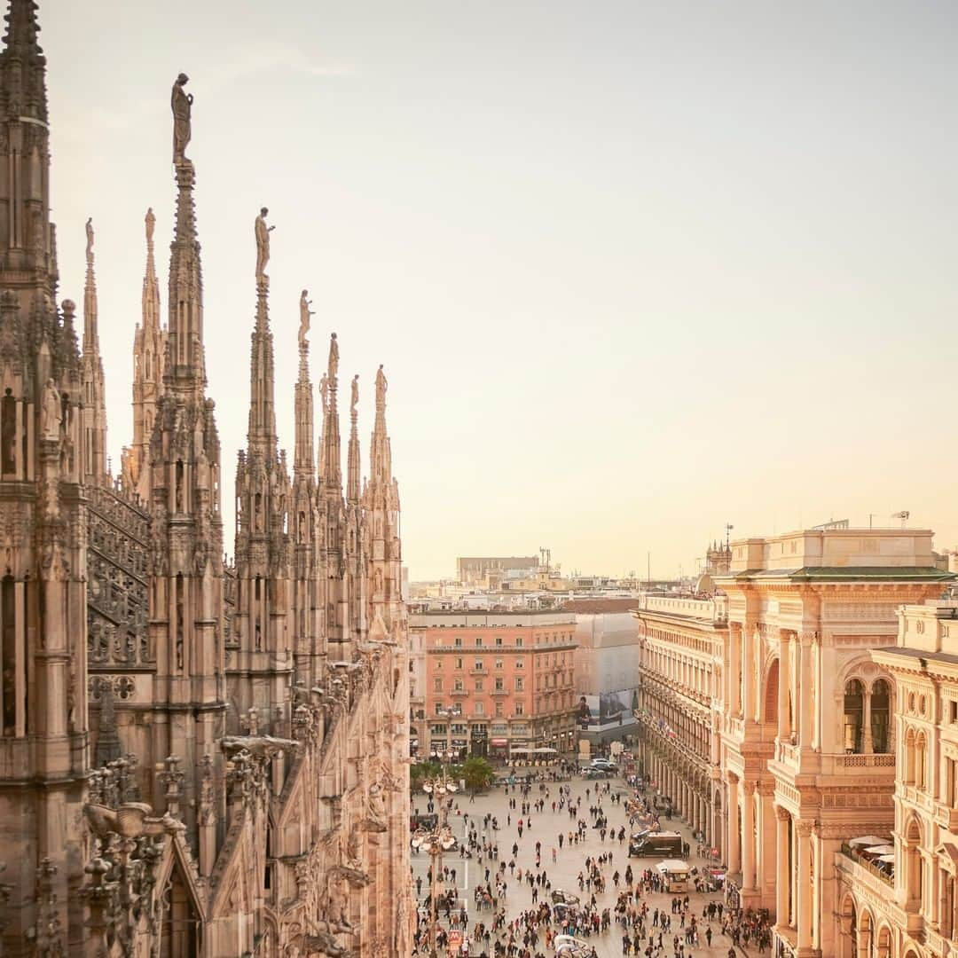 National Geographic Travelさんのインスタグラム写真 - (National Geographic TravelInstagram)「Photo by @chiaragoia | A corner of the Piazza del Duomo (Cathedral Square) in Milan, Italy, with the entrance to the Galleria Vittorio Emanuele II to the right. Seen from the roof of the Duomo during sunset.  Follow @chiaragoia for more images of Milan and other places. #duomo #milano #pinnacles #sunset #italy」1月27日 18時08分 - natgeotravel