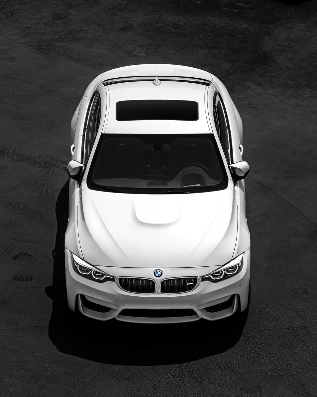 BMWのインスタグラム：「Light and Power. The BMW M4 Coupé. #TheM4 #BMW #M4 #BMWM #BMWrepost @Carsbymg __ BMW M4 Coupé: Fuel consumption in l/100 km (combined): 10.0 [9.3]. CO2 emissions in g/km (combined): 227 [213]. Acceleration (0-100 km/h): 4.3 s [4.1 s]. Power: 317 kW, 431 hp, 550 Nm. Top speed (limited): 250 km/h (with optional M Drivers Package: 280 km/h). Paint finish shown: Mineral White metallic.  The figures in brackets refer to the vehicle with seven-speed M double-clutch transmission with Drivelogic. The values of fuel consumptions, CO2 emissions and energy consumptions shown were determined according to the European Regulation (EC) 715/2007 in the version applicable at the time of type approval. The figures refer to a vehicle with basic configuration in Germany and the range shown considers optional equipment and the different size of wheels and tires available on the selected model. The values of the vehicles are already based on the new WLTP regulation and are translated back into NEDC-equivalent values in order to ensure the comparison between the vehicles. [With respect to these vehicles, for vehicle related taxes or other duties based (at least inter alia) on CO2-emissions the CO2 values may differ to the values stated here.] The CO2 efficiency specifications are determined according to Directive 1999/94/EC and the European Regulation in its current version applicable. The values shown are based on the fuel consumption, CO2 values and energy consumptions according to the NEDC cycle for the classification. Further information on official fuel consumption figures and specific CO2 emission values of new passenger cars is included in the following guideline: 'Leitfaden über den Kraftstoffverbrauch, die CO2-Emissionen und den Stromverbrauch neuer Personenkraftwagen' (Guide to the fuel economy, CO2 emissions and electric power consumption of new passenger cars), which can be obtained free of charge from all dealerships, from Deutsche Automobil Treuhand GmbH (DAT), Hellmuth-Hirth-Str. 1, 73760 Ostfildern-Scharnhausen and at https://www.dat.de/co2/.」