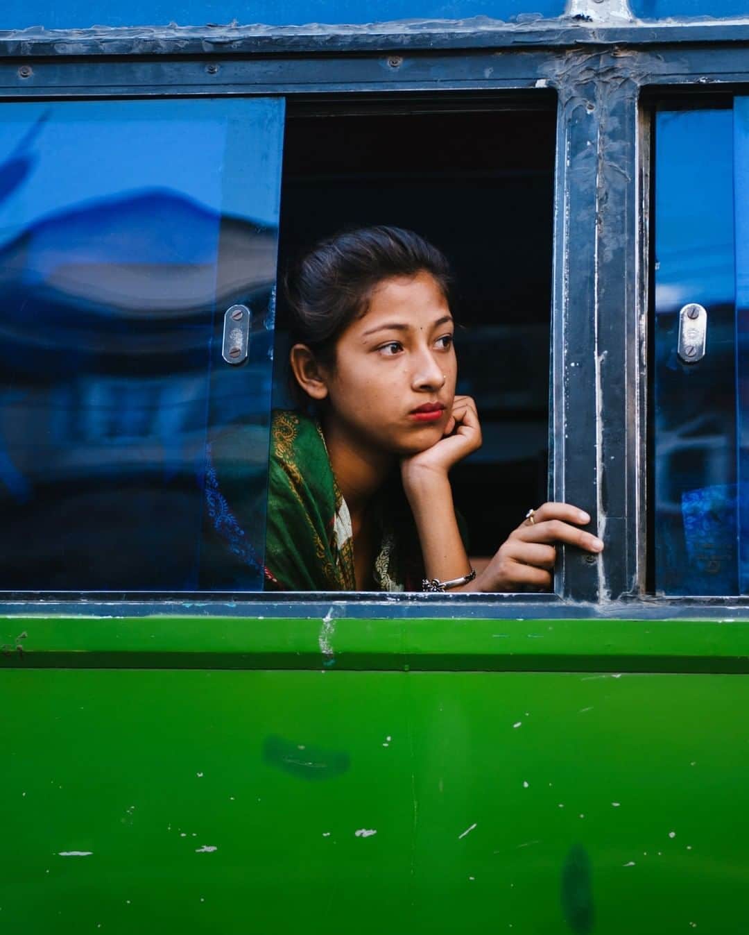 National Geographic Travelさんのインスタグラム写真 - (National Geographic TravelInstagram)「Photo by @max.lowe | Amid the rush of evening traffic on the raucous streets of Kathmandu, Nepal, a young woman sits in a moment of thought on her bus ride to somewhere. I love how in a photo you can capture a moment of stillness and peace like this, even in the chaos of a hectic scene.  To see more from his travels across the globe, follow @max.lowe.」1月30日 22時07分 - natgeotravel