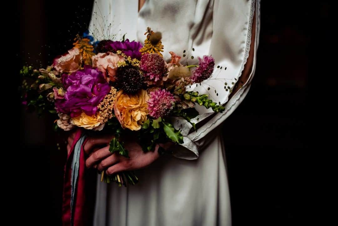 ミナさんのインスタグラム写真 - (ミナInstagram)「Flowers can add such a personal touch to any wedding. Here is a photo from a shoot with a burst of colour provided by @greenandenvy 💐 We love seeing the different variations #brides and #grooms pick for their day.   This styled shoot featuring our gorgeous silk dress Tanita is now up on our blog. Link in bio.  Photography: @laurenhensonphotos  Video: @dannyjackphotography  Makeup: @pandamakeup  Hair: @ellenpebbleslnd_  Model: @izzyfances.w  Florist: @greenandenvy  Ribbon and linens: @miasylviaa  #Flower #Bouquet #WeddingBouquet #SustainableDress #WeddingDress #FloralArrangement #WeddingFlower #EthicalFashion #EthicalWedding #BohemianWedding #bridal #alternativewedding #weddings2020 #weddinginspiration #weddings #sustainablewedding #ethicalwedding #indiebridelondon」1月31日 5時26分 - indiebride.london