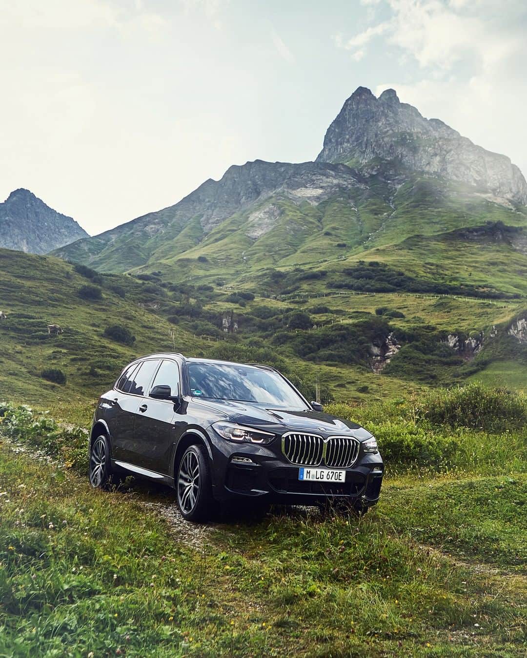 BMWのインスタグラム：「Ready for the wilderness. The BMW X5.  #TheX5 #BMW #X5 __ BMW X5 xDrive45e: Energy consumption in kWh/100 km (combined): 23.5–20.3. Fuel consumption in l/100 km (combined): 2.0–1.7. CO2 emissions in g/km (combined): 47–39.  Acceleration (0-100 km/h): 5.6 s. Power: 290 kW, 394 hp, 600 Nm. Top speed (limited): 235 km/h.  The values of fuel consumptions, CO2 emissions and energy consumptions shown were determined according to the European Regulation (EC) 715/2007 in the version applicable at the time of type approval. The figures refer to a vehicle with basic configuration in Germany and the range shown considers optional equipment and the different size of wheels and tires available on the selected model. The values of the vehicles are already based on the new WLTP regulation and are translated back into NEDC-equivalent values in order to ensure the comparison between the vehicles. [With respect to these vehicles, for vehicle related taxes or other duties based (at least inter alia) on CO2-emissions the CO2 values may differ to the values stated here.] The CO2 efficiency specifications are determined according to Directive 1999/94/EC and the European Regulation in its current version applicable. The values shown are based on the fuel consumption, CO2 values and energy consumptions according to the NEDC cycle for the classification. Further information on official fuel consumption figures and specific CO2 emission values of new passenger cars is included in the following guideline: 'Leitfaden über den Kraftstoffverbrauch, die CO2-Emissionen und den Stromverbrauch neuer Personenkraftwagen' (Guide to the fuel economy, CO2 emissions and electric power consumption of new passenger cars), which can be obtained free of charge from all dealerships, from Deutsche Automobil Treuhand GmbH (DAT), Hellmuth-Hirth-Str. 1, 73760 Ostfildern-Scharnhausen and at https://www.dat.de/co2/.」