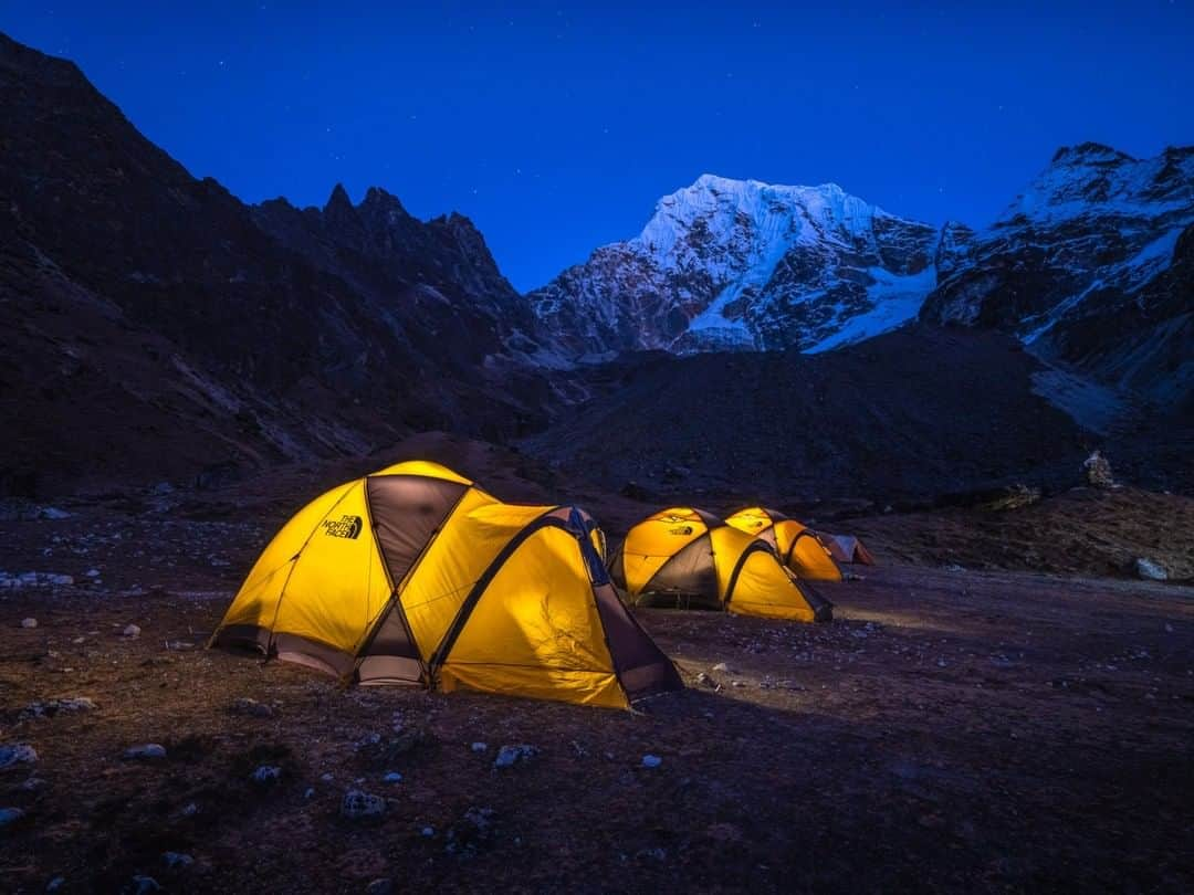 National Geographic Travelさんのインスタグラム写真 - (National Geographic TravelInstagram)「Photo by @michaelclarkphoto | While on a recent climbing expedition in the Khumbu Valley of Nepal with Pasang Lhamu Sherpa Akita, the 2016 National Geographic People's Choice Adventurer of the Year, our Sherpas set up an incredible base camp under Cholatse. We were so late in the season that we had it all to ourselves. This image was created on a cold, clear night right at sunset with solar-powered lamps in each of the tents. Stunning scenery surrounded us in every direction. #nepal #cholatse # khumbu #himalaya」1月8日 22時07分 - natgeotravel