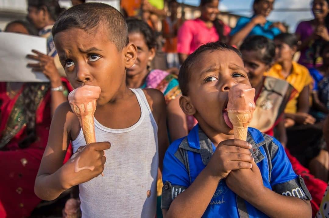 National Geographic Travelさんのインスタグラム写真 - (National Geographic TravelInstagram)「Photo by @amivitale | Children enjoy ice cream during their annual sports meet at the St. Roche school in Jaffna on Sri Lanka’s northern peninsula. I had the privilege of working in Sri Lanka for National Geographic as we looked at the memory of its civil war, which ended in 2009, and the paths to peace.  Follow @amivitale for more stories about the beauty and hope in the world. @natgeoimagecollection @thephotosociety #srilanka #staystrong #icecream」1月12日 14時09分 - natgeotravel