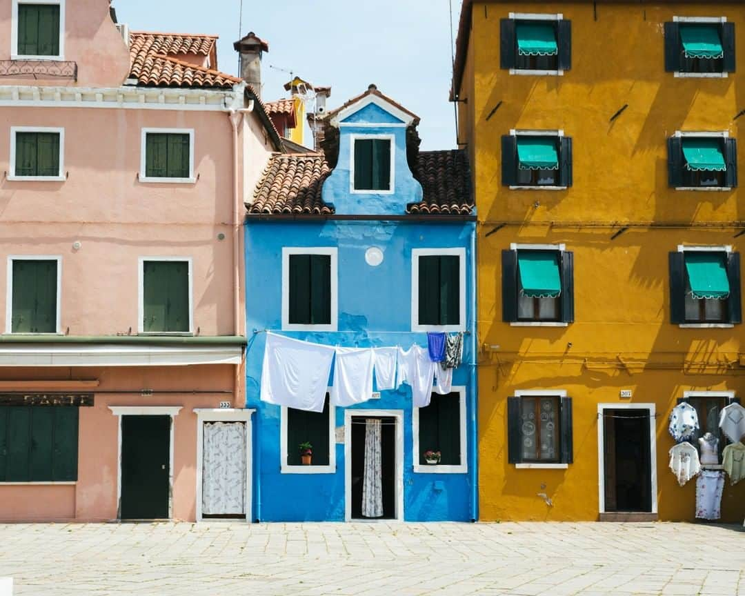 National Geographic Travelさんのインスタグラム写真 - (National Geographic TravelInstagram)「Photo by @MichaelGeorge | The colorful island of Burano, Italy, is a short ride from Venice. It has fewer crowds and brighter paint, giving the island a rainbow aesthetic. In this image, a local is drying laundry outside their brilliantly blue home. #burano #italy #color #brightbuilding #buranoitaly」1月14日 22時07分 - natgeotravel