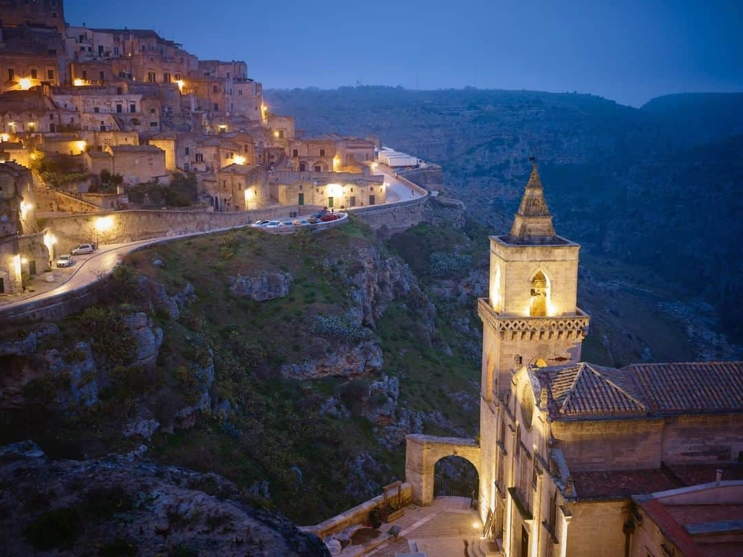 ナショナルジオグラフィックさんのインスタグラム写真 - (ナショナルジオグラフィックInstagram)「Photo by @simonnorfolkstudio I San Pietro Caveoso church stands above the gorge of the Gravina River in the city of Matera, in the southern region of Basilicata, Italy. Known as la Città Sotterranea (the subterranean city), it's centered on the Sassi di Matera (stones of Matera). The Sassi originate from a prehistoric troglodyte settlement, and are suspected to be some of the first human settlements in Italy. Indeed, Matera is the only place in the world where people can boast to be living in the same houses of their ancestors of 9,000 years ago. Miserably poor throughout the centuries, and a burden on the national psyche, the Sassi were forcibly cleared in the 1950s, but in recent years have seen the return of tourists, boutique hotels, and Hollywood film crews. Matera was a European Capital of Culture for 2019. Follow @simonnorfolkstudio for updates, outtakes, and unpublished and archival material. #matera #italy #unesco #Sassi #europe」1月20日 0時38分 - natgeo