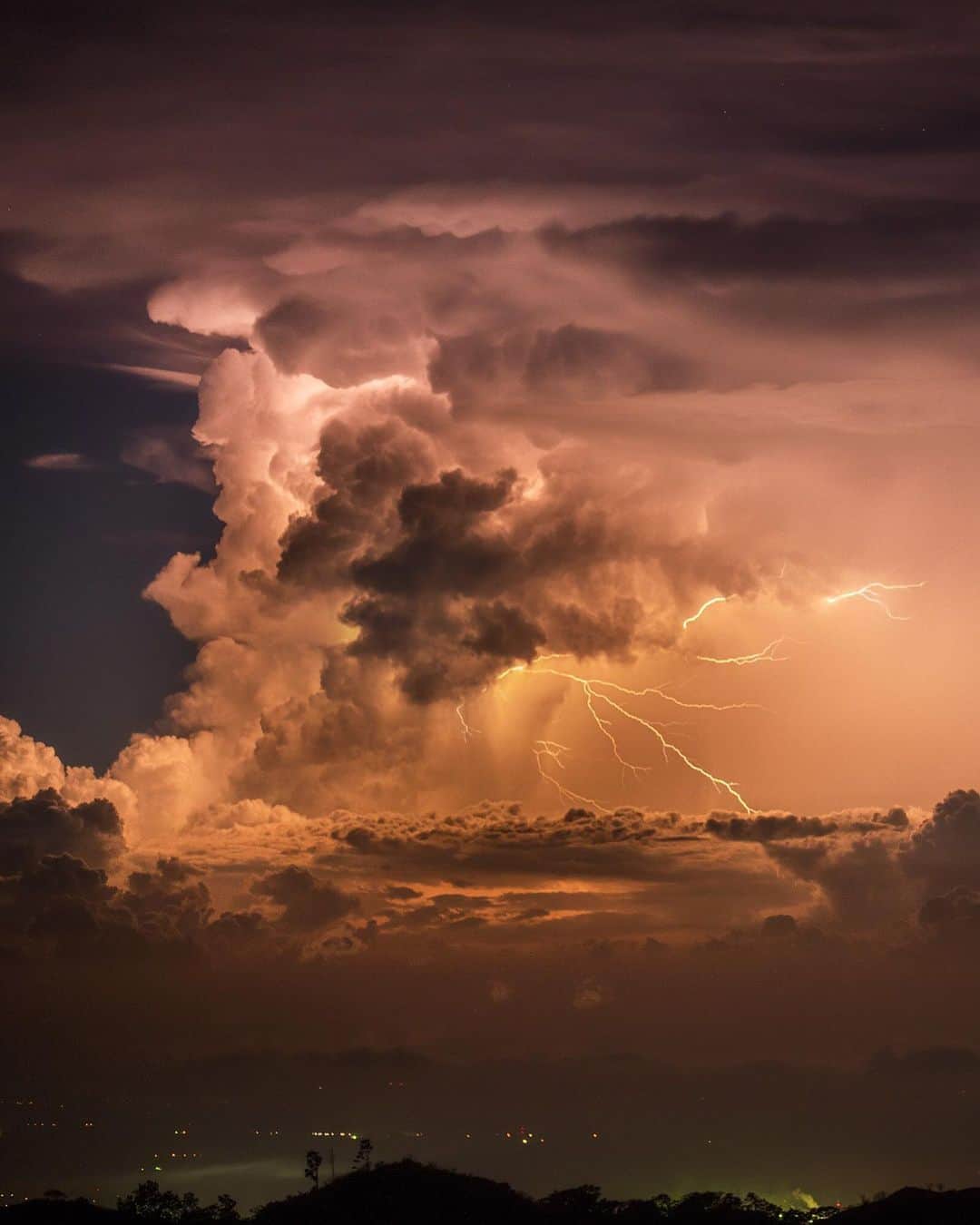 のインスタグラム：「Photos by @babaktafreshi | The show never ended on this late November night, as I watched thunderstorms in Guatemala. An average of 40-50 lightning flashes occur every second on the planet, a total of 1.4 billion a year. Most occur over land in the tropics. Follow me @babaktafreshi for more of the World at Night photography. ⁣#storm #weather #climate #tropics」