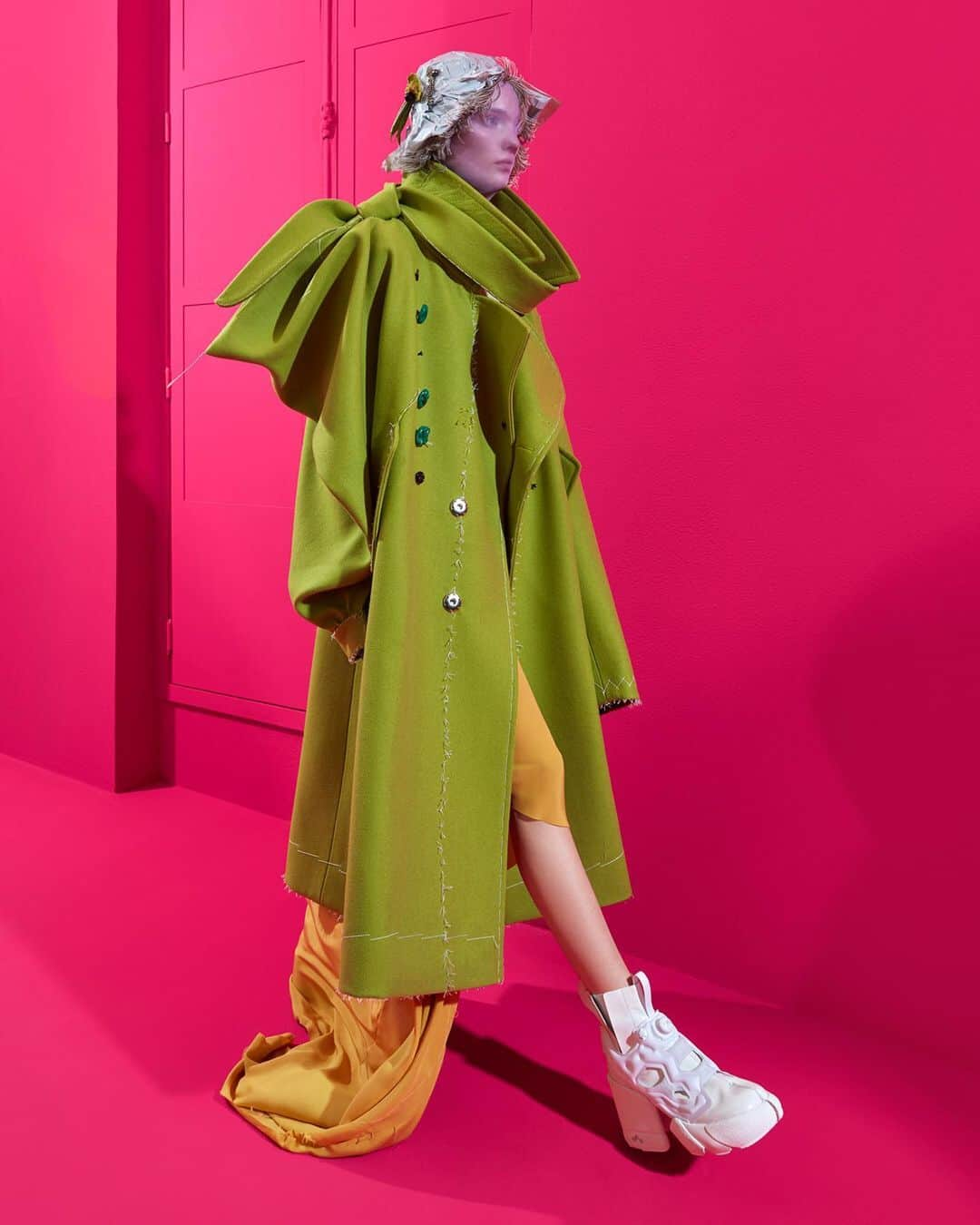 Maison Margielaさんのインスタグラム写真 - (Maison MargielaInstagram)「#MaisonMargiela ‘Artisanal’ Co-ed SS20 Collection designed by @JGalliano Look 2 Pistachio wool overcoat with an asymmetric bow sleeve and neck detailing and ceramic buttons, worn over a yellow crêpe de cine bias-cut dress. White Maison Margiela x Reebok shoes.」1月26日 16時23分 - maisonmargiela