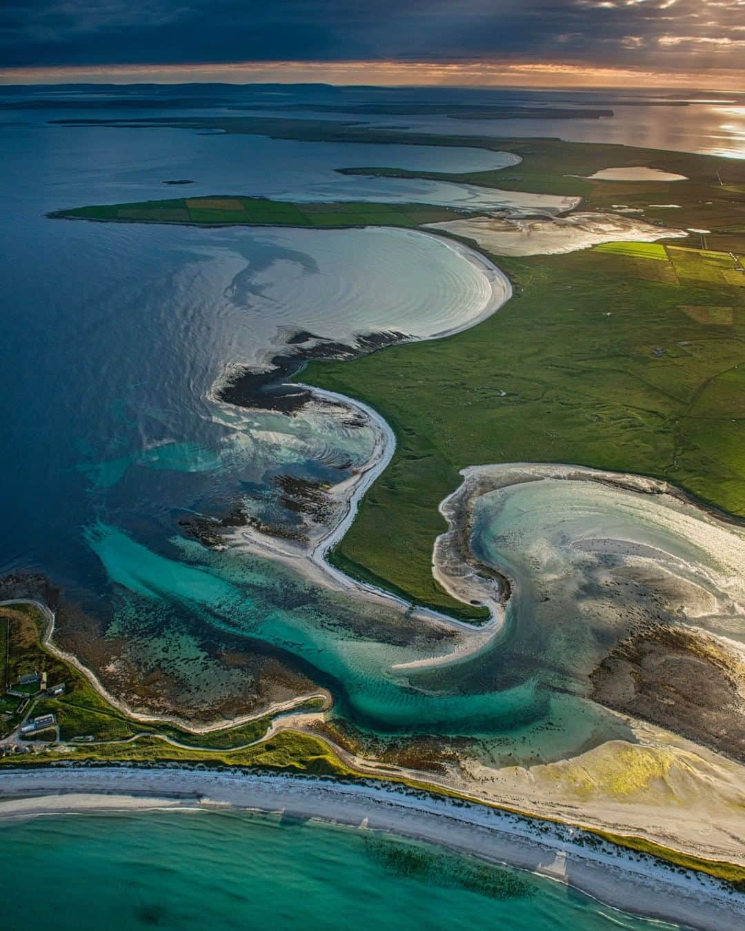 National Geographic Travelさんのインスタグラム写真 - (National Geographic TravelInstagram)「Photo by @JimRichardsonNG | Flying over Sanday you can see how dynamic the islands of Orkney truly are, constantly building dunes on one side while beaches are carving into farmland on the other. Here, the sea has made a large incursion, breaking into the interior to create a tidal bay at Overbister. (“Bister” is old Norse for a farm.) The farm at Overbister is caught in the middle of this geological bickering; when will the tides or a winter storm choose to remake the coastline once again? Really hard to say what it looked like when the Vikings came, let alone when the Neolithic people started farming here 6,000 years ago.  Follow me @JimRichardsonNG for more Scotland. #scotland #orkney」1月27日 14時09分 - natgeotravel