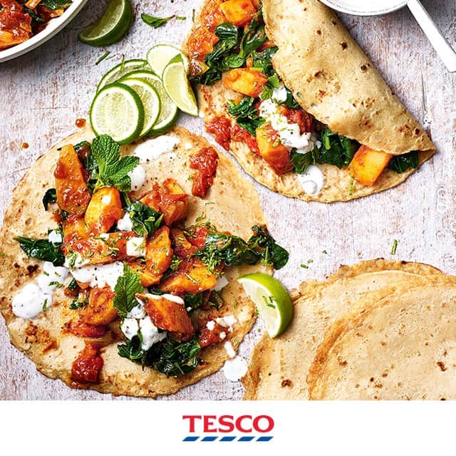Tesco Food Officialさんのインスタグラム写真 - (Tesco Food OfficialInstagram)「Flip pancake day on its head. Watch our highlights to spice up your dish with delicious curry-infused crepes and saag aloo filling.  Ingredients 400g baking potatoes, peeled and diced 1½ tbsp vegetable oil 1 small onion, roughly chopped 100g tikka curry paste 220g pack baby spinach, chopped 227g tin chopped tomatoes 155g bottle pancake shaker mix 1 tsp ground cumin ½ tsp hot chilli powder 3 tbsp plain flour 8g fresh mint, leaves picked, to serve 150g raita dip, to serve 1 lime, cut into wedges, to serve  Method Boil the potatoes for 5-6 mins until just tender; drain and set aside. Heat 1 tbsp oil in a saucepan over a low-medium heat and fry the onion for 3 mins. Add the tikka paste and cook, stirring, for 1-2 mins until fragrant. Stir through the potatoes, spinach and 4 tbsp of water and cook for 2 mins. Stir through the tomatoes, cover and cook for 5 mins until glossy. Set aside, covered. Shake the pancake shaker mix to loosen. Add the spices and flour, pour in 325ml cold water, replace the cap and shake until smooth. Heat a frying pan over a medium heat and brush with ½ tbsp oil. Pour in enough batter to form a thin pancake. Cook for 30 secs-1 min until it moves freely. Flip, then cook for 30 secs-1 min until golden. Transfer to a plate and cover to keep warm. Repeat with the remaining batter to make 8 pancakes. Reheat the saag aloo over a low-medium heat, then scatter with the mint. Fill the pancakes with mix, spoon over raita and wrap. Serve with the lime wedges.」2月24日 20時00分 - tescofood