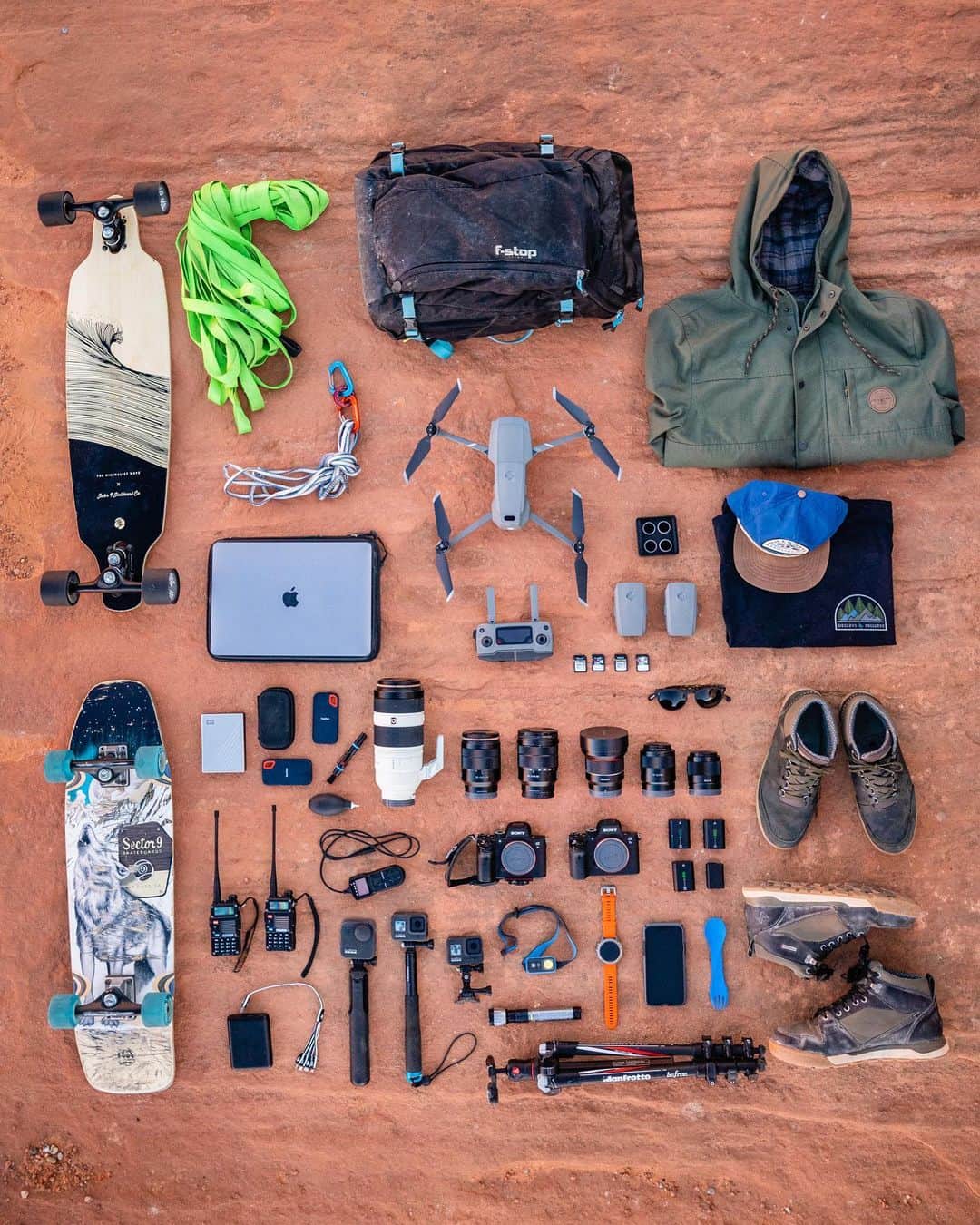 Travis Burkeのインスタグラム：「Tools, Toys & Tech.  I frequently receive messages asking what gear I use or recommend, and sadly, I can’t possibly respond to them all. I wanted to use this as an opportunity to showcase a lot of my everyday gear and try to answer any questions you might have.  Below is a list of most of the items in the photo.  I’ll do my best to answer every question in the comments and I hope others can read and learn from the questions and answers below as well! Thank you all for the continued support!  CAMERAS- Sony A7RIII + Sony A7SII.  LENSES- 14mm f/2.8, 28mm f/2, 55mm f/1.8, 16-35mm f/4, 24-70mm f/4, 100-400mm f/4.5-5.6.  GOPROS- @gopro Hero8 x2, and MAX 360° camera.  TRIPOD- Manfrotto Befree CF.  DRONE- DJI Mavic Pro 2 Zoom.  LAPTOP- 2018 Mac Book Pro 15”. HARD DRIVES- Sandisk 1 TB SSD x2, WD 4 TB.  FLASHLIGHT- @GoalZero Switch 10.  HEADLAMP- Black Diamond Ion.  SHOES- @forsakeco Clyde II’s & Phil Mid’s.  RADIOS- BaoFeng BF-F8HP.  CLOTHES- @HippyTree Mid land Jacket + any hat and tee combo.  SKATEBOARDS- @Sector9 Howl Ninety Five + any carving board.  SLACKLINE- @balancecommunity 33m Feather webbing.  BACKPACK- F-Stop Kashmir UL.  SPORK- Any reusable utensil to help reduce plastic waste :). #whatsinthebag #gear #knolling #geardump #photographygear」