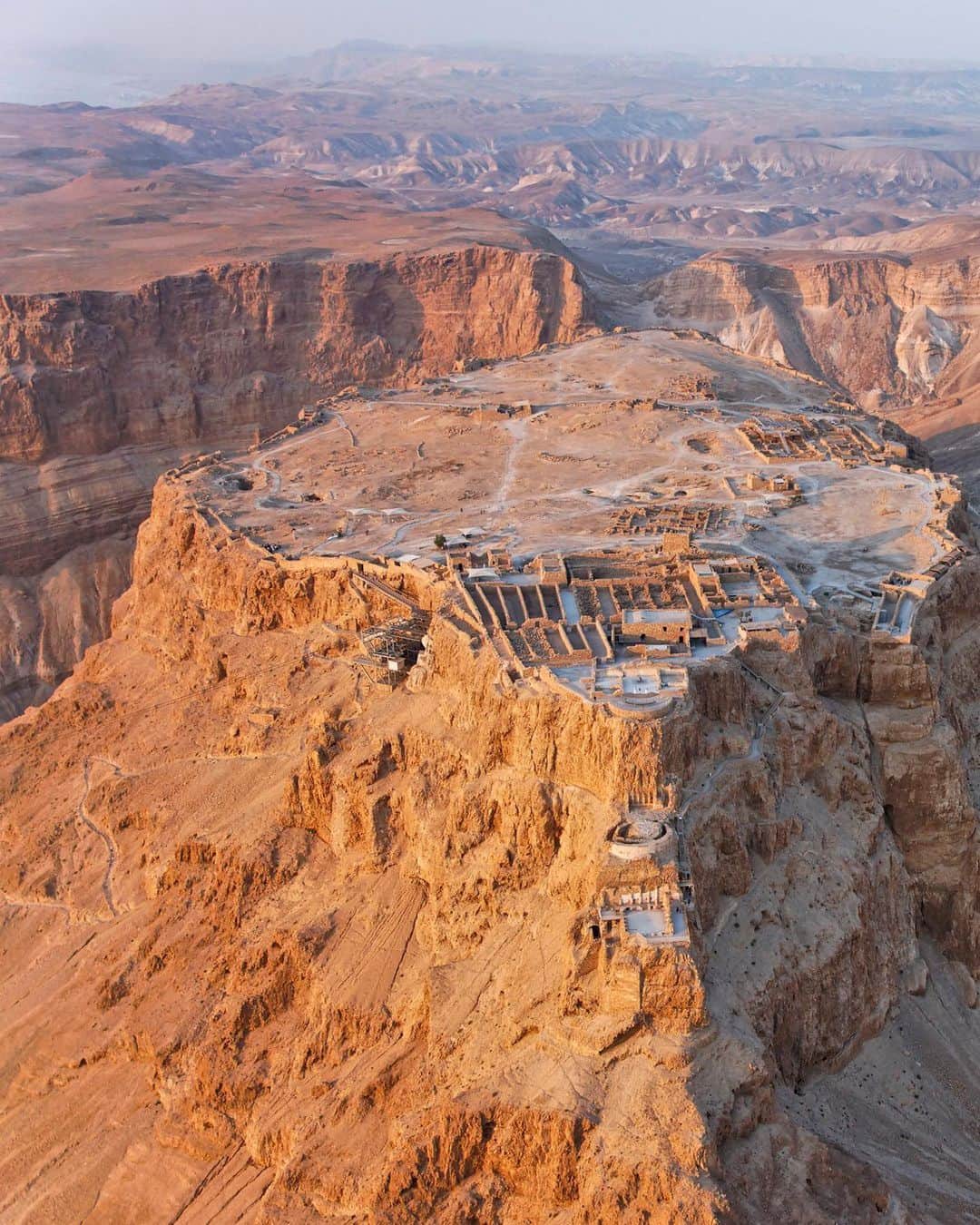 National Geographic Travelさんのインスタグラム写真 - (National Geographic TravelInstagram)「Photo by George Steinmetz @geosteinmetz | Masada, the ancient Jewish citadel, has become a symbol for the state of Israel. It was besieged in A.D. 70 by the Romans, who encircled it before building an earthen ramp (seen at right) to capture it from its determined Jewish inhabitants. The defenders are said to have died in a mass suicide rather than submit to Roman rule, but the truth of what happened there may never be known.  To explore more of our Earth from above, follow @geosteinmetz. #paramotor」2月4日 6時23分 - natgeotravel
