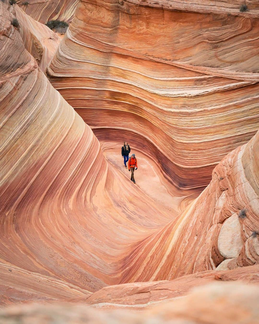 Travis Burkeのインスタグラム：「Yesterday we were lucky enough to get the elusive permits to one of our favorite places on earth!  It barely got above freezing but conditions were perfect. We spent 11 hours hiking around this swirling landscape and even scored an epic sunset! (More photos coming soon). Out of nowhere the wind would pick up and blast sand and dust at 40+ mph (64 km/h) then, a few seconds later it would circle back and blast us in the opposite direction. This gave us a first hand look, and feel, at how this place was created.  The Wave, Arizona with @brandon_dugi and @gypsealaysea.  We pulled over on the side of the road to share part of our journey and are disappearing back into the wonderful world of no service :) I hope you all have an incredible weekend!  Get out there and do something memorable!  #arizona #thewave #thewavearizona #getoutthere」