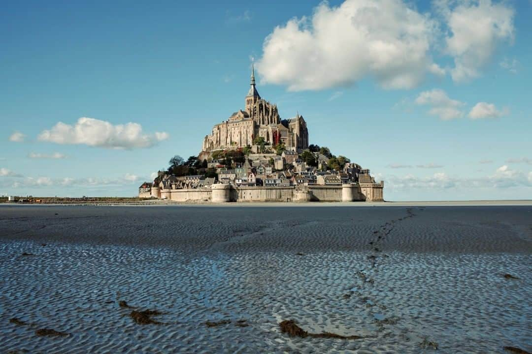 National Geographic Travelさんのインスタグラム写真 - (National Geographic TravelInstagram)「Photo by @paoloverzone | Mont Saint-Michel in Normandy, France. The tidal island has ancient origins, and it was first inhabited by an Irish hermit. Because of its natural defensive properties, it was used for centuries as a stronghold and safe place for pilgrims. I’ve been several times to this mysterious place and every time I felt its charm intact.  Follow @paoloverzone for more photos and stories. #normandy #montsaintmichel」2月9日 10時04分 - natgeotravel