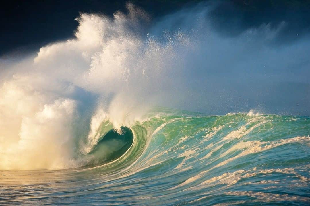 National Geographic Travelさんのインスタグラム写真 - (National Geographic TravelInstagram)「Photo by @michaelclarkphoto | Waves explode in Waimea Bay on the North Shore of Oahu, Hawaii, the day before the 2009/2010 Quiksilver In Memory of Eddie Aikau big-wave surfing competition. On this morning the top surf photographers from around the world were lined up on the roadside at Waimea Bay, blasting away as the giant waves rolled in. I remember shooting thousands of images, but even more than that I remember the great conversations rolling back and down the line as we all looked through our lenses and watched the waves roll in from the wee hours of the morning until later that afternoon. There must have been a few million dollars in camera gear lined up there as well. Fun times on the North Shore. #waimeabay #waimea #northshore #oahu #bigwaves」2月10日 22時08分 - natgeotravel