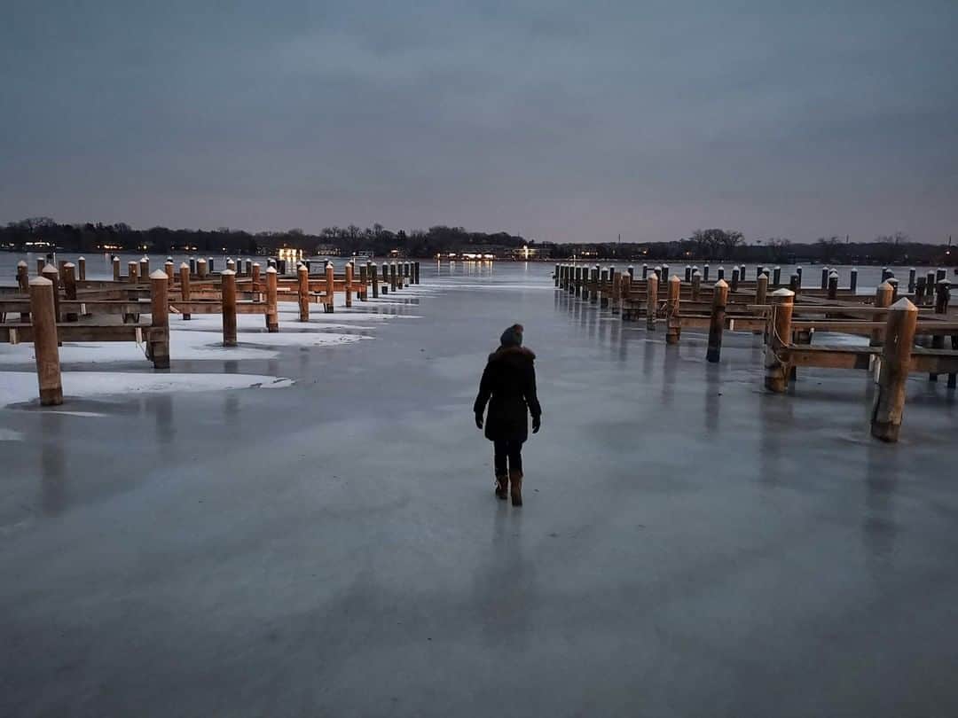 National Geographic Travelさんのインスタグラム写真 - (National Geographic TravelInstagram)「Photo by Robbie Shone @shonephoto | In the early evening a traveler walks out onto the frozen surface of Lake Minnetonka in Minnesota.」2月11日 6時05分 - natgeotravel