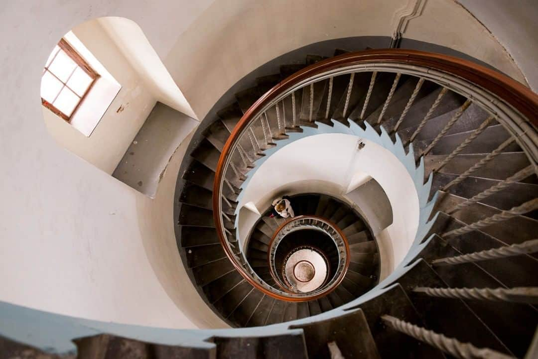 National Geographic Travelさんのインスタグラム写真 - (National Geographic TravelInstagram)「Photo by @KristaRossow | The view of the spiral staircase inside the Lyngvig Lighthouse in Denmark can induce a bit of vertigo. This lighthouse along the North Sea affords amazing views over rolling sand dunes near the town of Hvide Sande. To get to the top, buy a ticket, climb the spiral staircase, and clamber out a tiny door onto the top landing.  Follow me @KristaRossow for more images from around the world. #Denmark #lighthouse」2月12日 6時05分 - natgeotravel