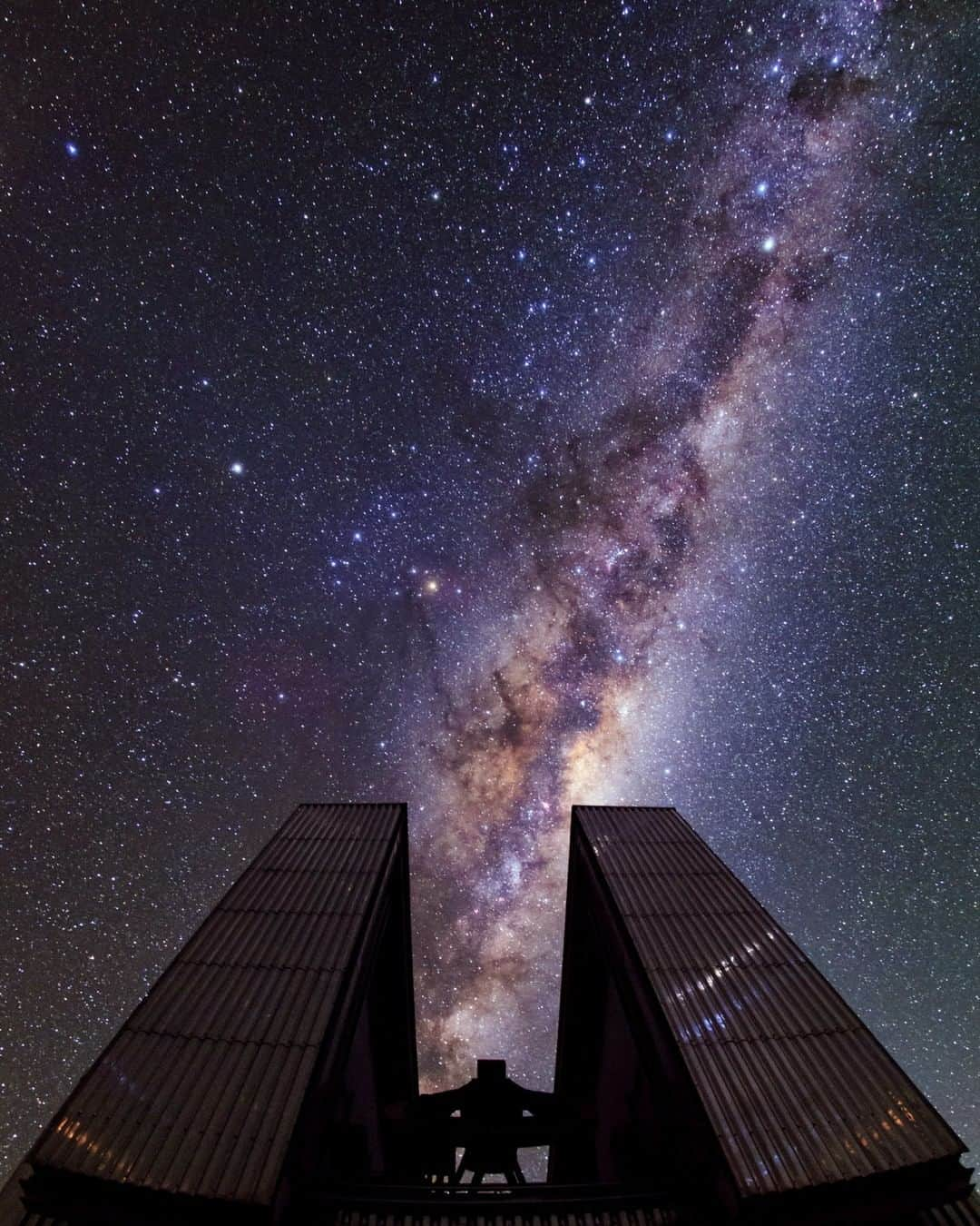 ナショナルジオグラフィックさんのインスタグラム写真 - (ナショナルジオグラフィックInstagram)「Photo by @babaktafreshi | A large telescope at La Silla Observatory is used to explore the universe under the spectacular southern sky in Chile. I enjoy practicing techniques that reveal the night sky in a single-exposure photograph. After two decades in this field, I continue to embrace single exposures, which represent the joy of photography and the value of the moment. Most nightscape images are documentary—we do not add, multiply, or relocate natural elements, unless it’s for a creative illustration that is made evident to the audience. You would not add a moon or the Milky Way where it didn't exist in the frame; this topic is timely, as photo montages, double exposures, and fantasy edits become more popular in this genre—and are often posted without acknowledging the altered reality. I share these concerns and my personal techniques in the latest issue of Sky&Telescope magazine, from the nonprofit American Astronomical Association. Follow me @babaktafreshi for more of #astrophotography. #singleexposure #saveournightsky #nightscape #twanight」2月13日 20時38分 - natgeo