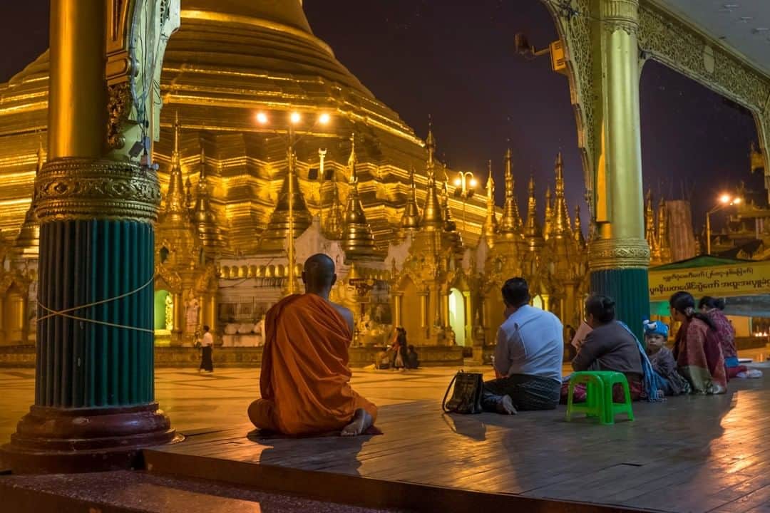 National Geographic Travelさんのインスタグラム写真 - (National Geographic TravelInstagram)「Photo by @KristaRossow | In the quiet hours before sunrise at Shwedagon Pagoda in Yangon, Myanmar, people like this monk and family find nooks to pray in before the day begins. I've visited this religious site multiple times for sunrise because I love the feel of the cool marble underneath my bare feet, the way the light changes on the stupa as the sky slowly illuminates, and the feeling of the sacred atmosphere at this Buddhist site.  Follow me @KristaRossow for more images from around the world. #Myanmar #Yangon #Shwedagon」2月15日 14時09分 - natgeotravel