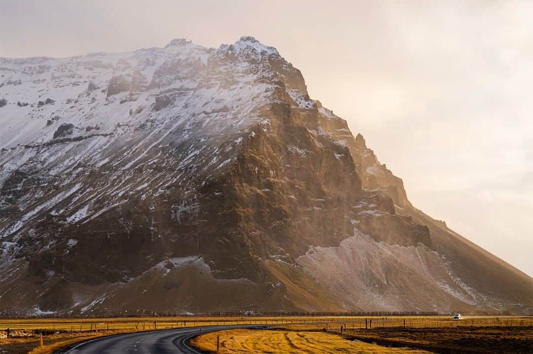 National Geographic Travelさんのインスタグラム写真 - (National Geographic TravelInstagram)「Photo by Matthew Borowick @mborowick | The incredible mass that many Icelandic mountains have is a sight in its own right. Towering over Route 1 is an unnamed mountain draped in the beautiful light of sunrise.  Please follow @mborowick for more images like these. #Iceland #sunrise #coast #nature #explore」2月16日 22時07分 - natgeotravel