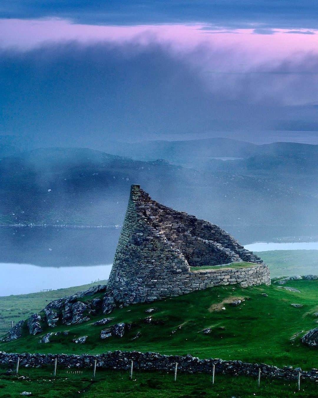 National Geographic Travelさんのインスタグラム写真 - (National Geographic TravelInstagram)「Photo by @JimRichardsonNG | The Isle of Lewis is loaded with megalithic ruins, romantic reminders of all the folk who have lived here before. Dun Carloway, pictured here, is on the way to the west coast, just above Loch an Duin, and juicy with history. It’s a broch, built about 2,000 years ago, very likely by traveling crews of broch builders who could make your dwelling the most impressive in the island neighborhood. Still formidable in 1601, when the Morrisons were hiding out inside before the MacAuleys (who wanted their cattle back) found them. Donald Cam MacAuley is said to have climbed the walls and smoked them out with burning heather. (MacAuleys, Morrisons, and cattle still live around here.) Stones were “robbed” from the walls, probably to be found in farmhouses down the road a bit.  Follow me @JimRichardsonNG for more Scotland. #scotland  Editor's Note: A previous version of this image had the wrong caption. The caption has been updated with the correct text.」2月19日 2時14分 - natgeotravel